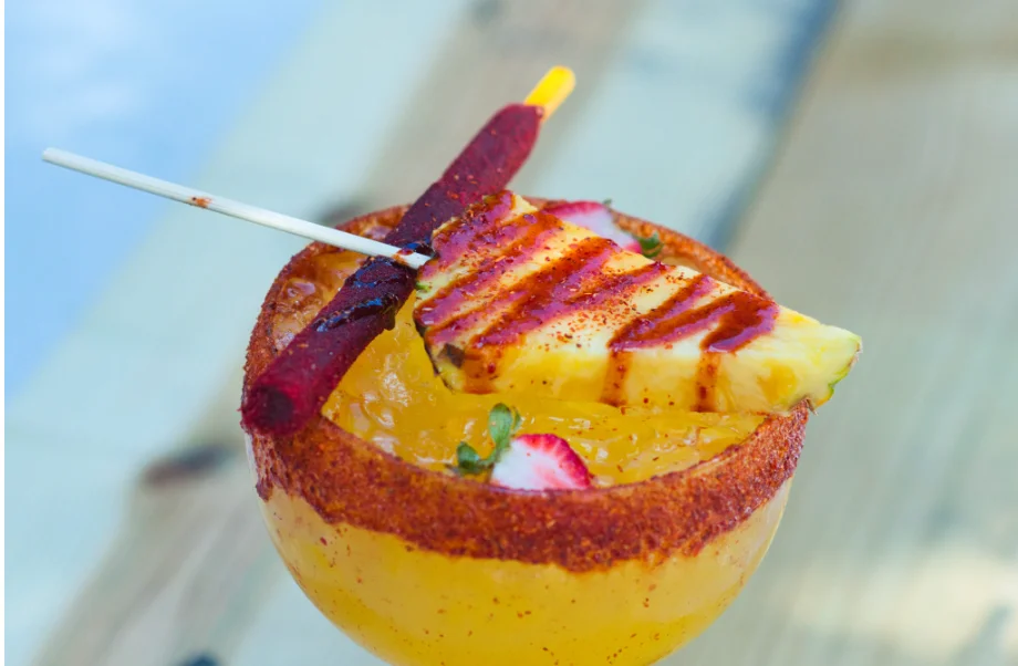 Colorful Mexican margarita with pineapple garnish