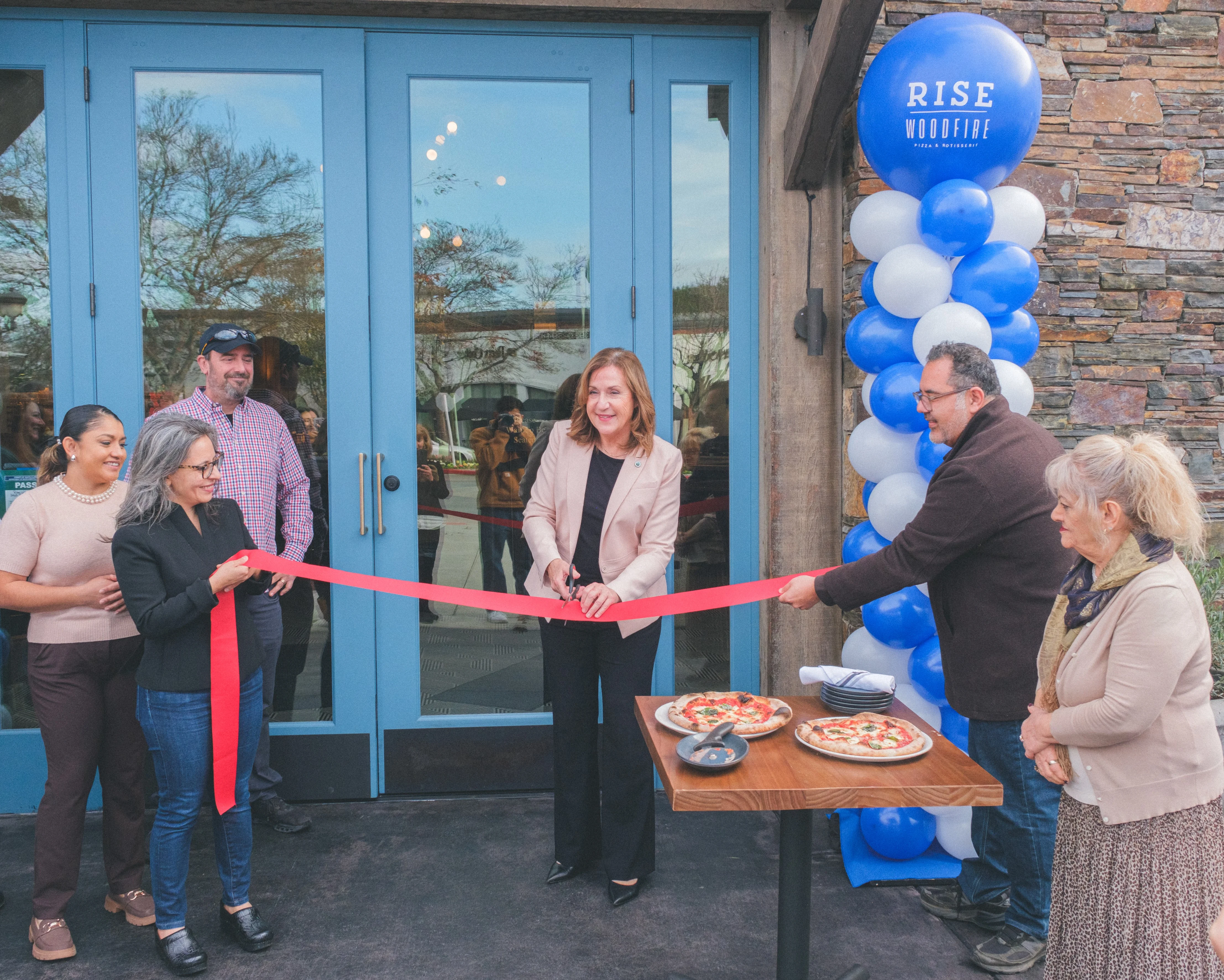 A ribbon-cutting ceremony at a new restaurant opening.