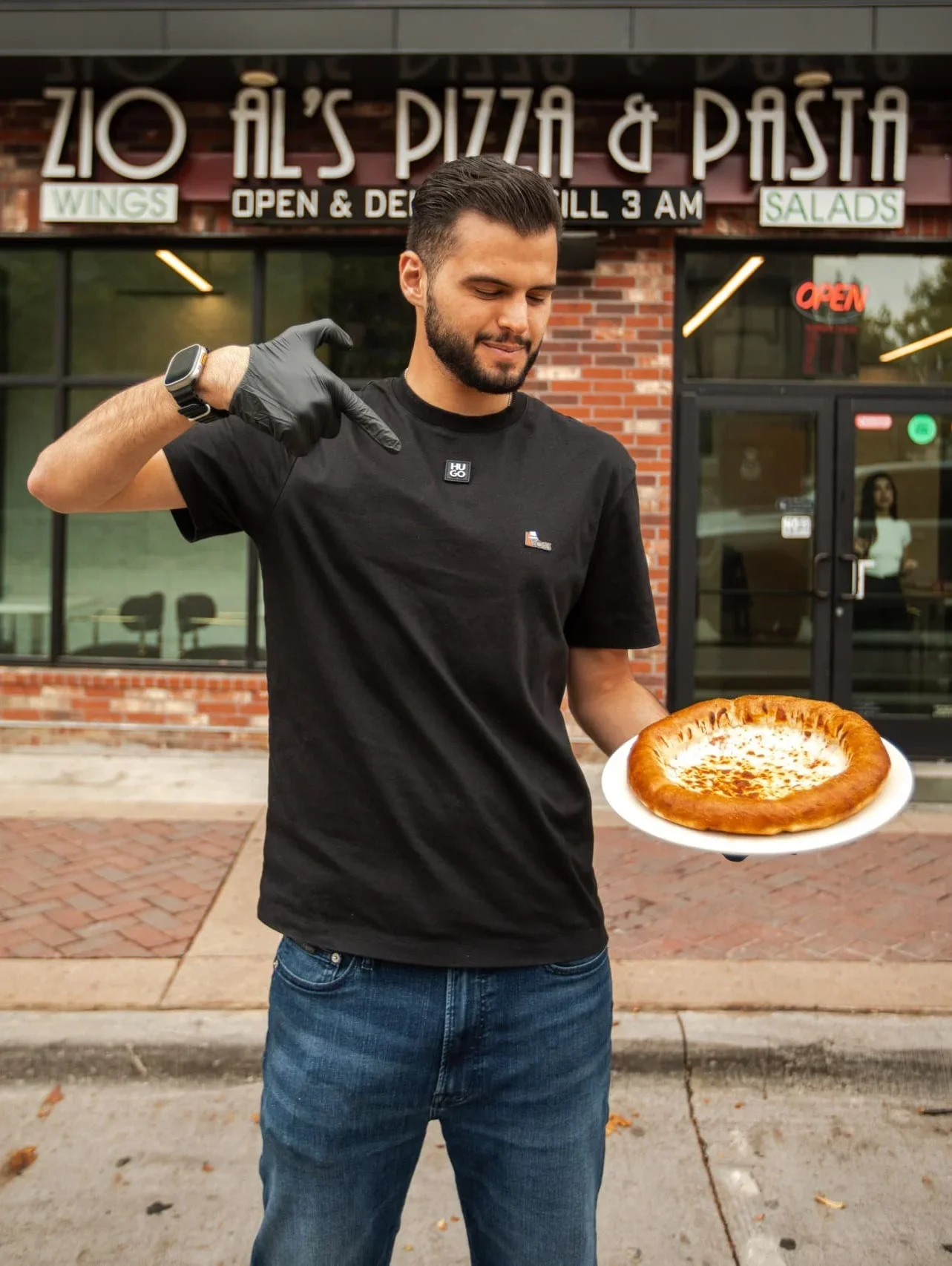 Freshly baked cheese pizza at Zio Al's Pizza & Pasta