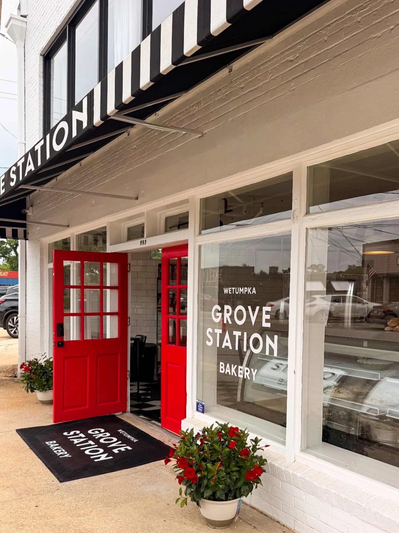 A logo featuring the text 'GROVE STATION' in bold, white letters on a black background.