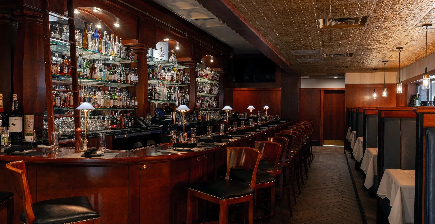 Interior view of Bass Street Bar and Dining with modern decor and seating.