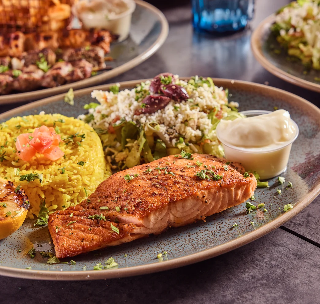Salmon Fillet Platter consisting of salmon with Mediterranean seasoning.