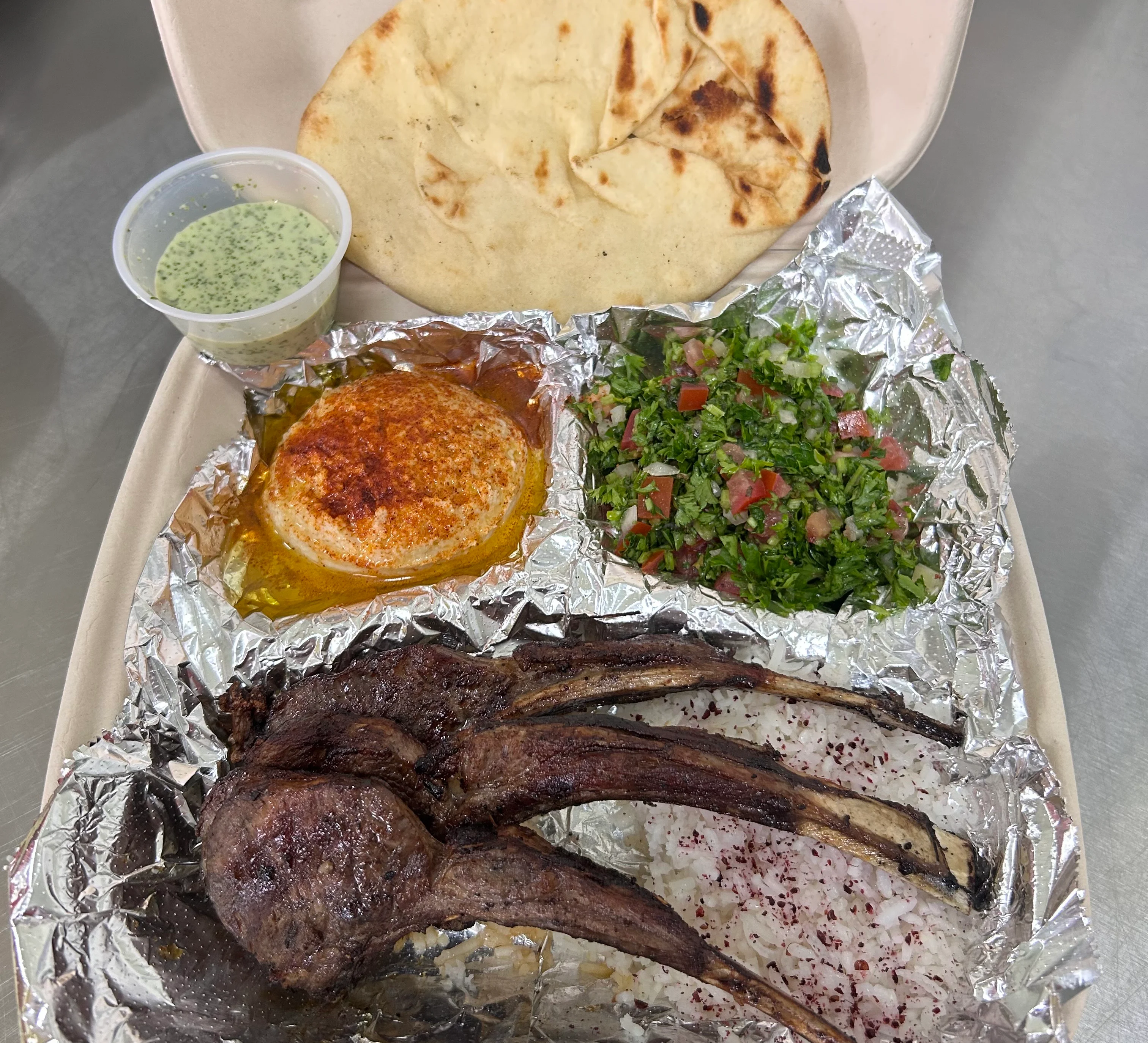Grilled lamb chops with tabbouleh and pita bread