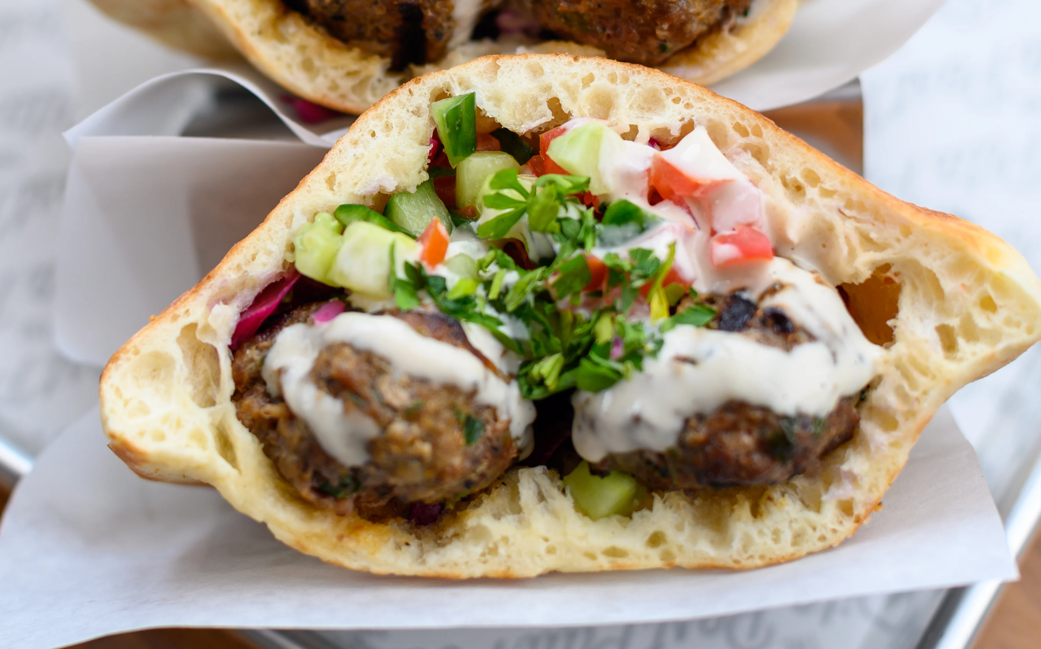 Pita bread stuffed with beef and pico de gallo.