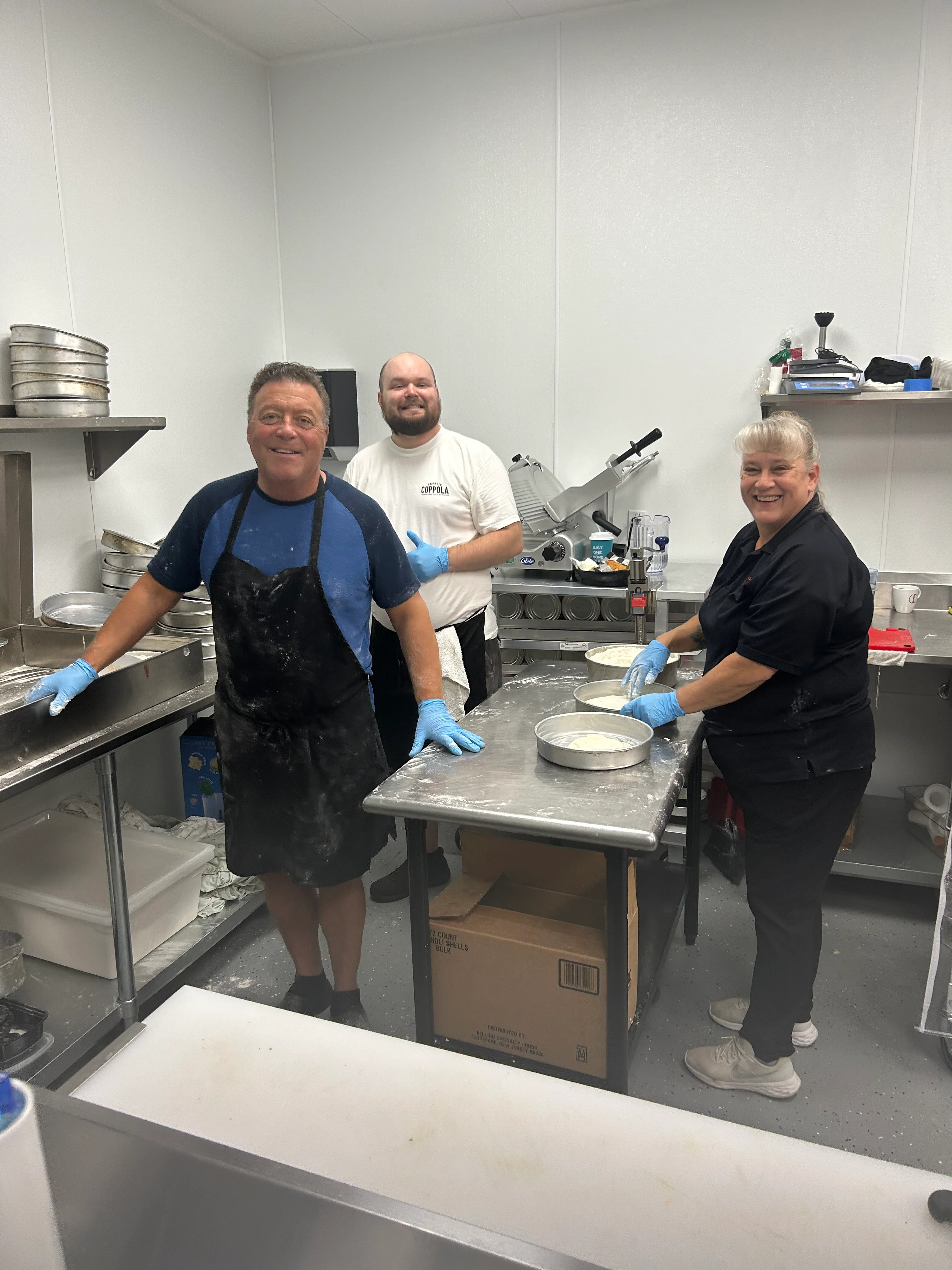 Chefs preparing desserts in a commercial kitchen