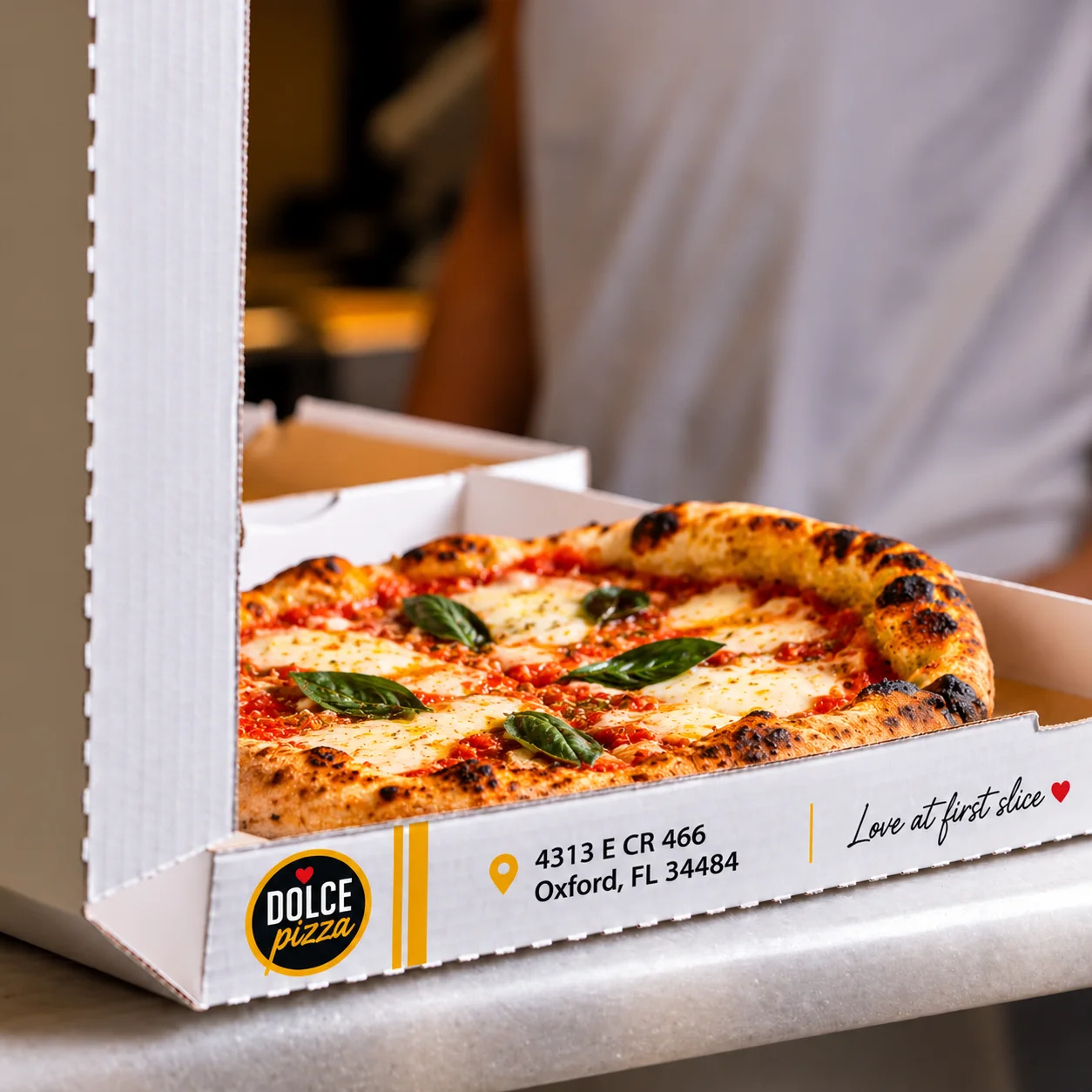 Neapolitan Margherita pizza in a takeaway box