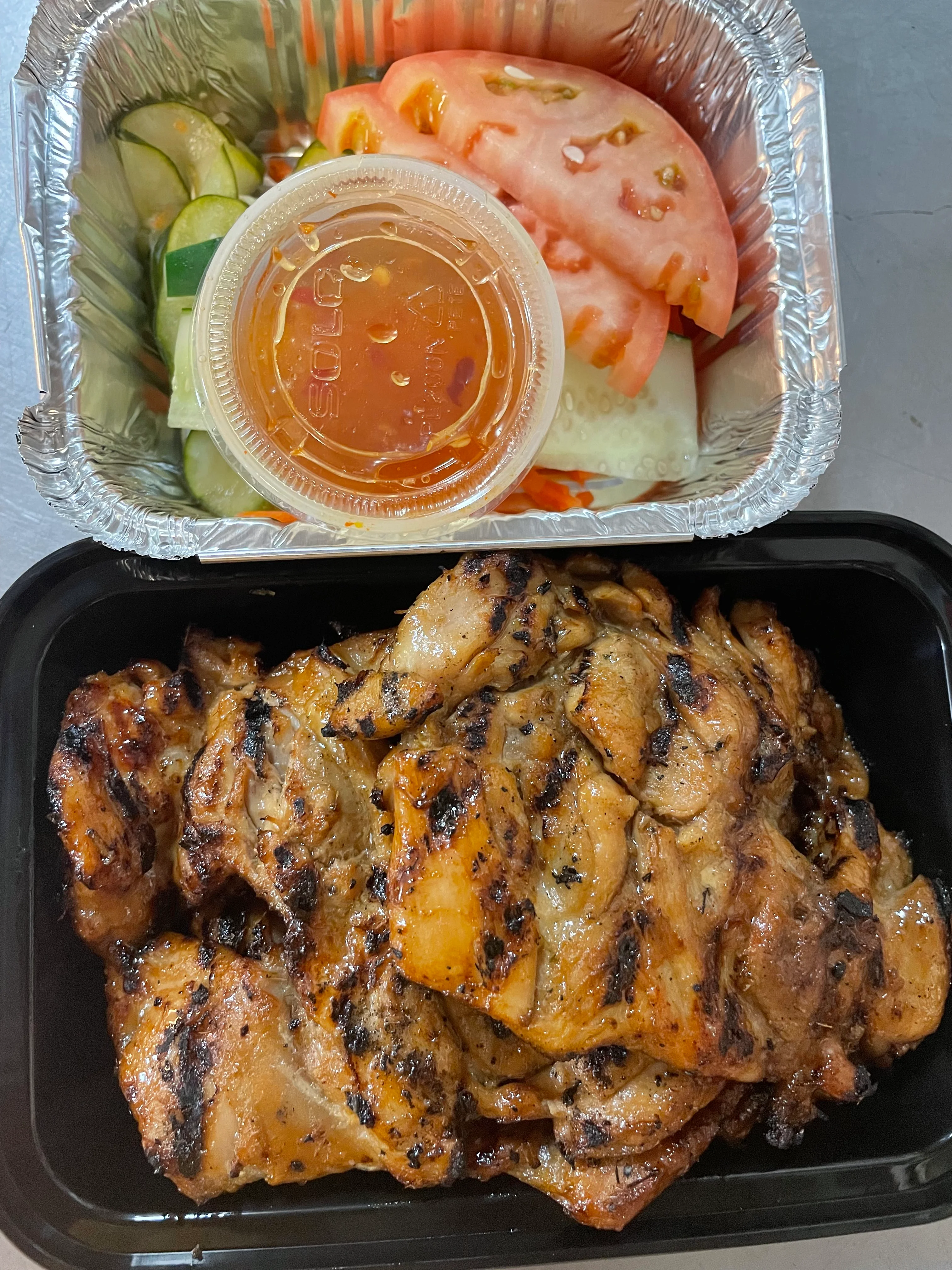 Grilled Vietnamese chicken with fresh salad and dipping sauce