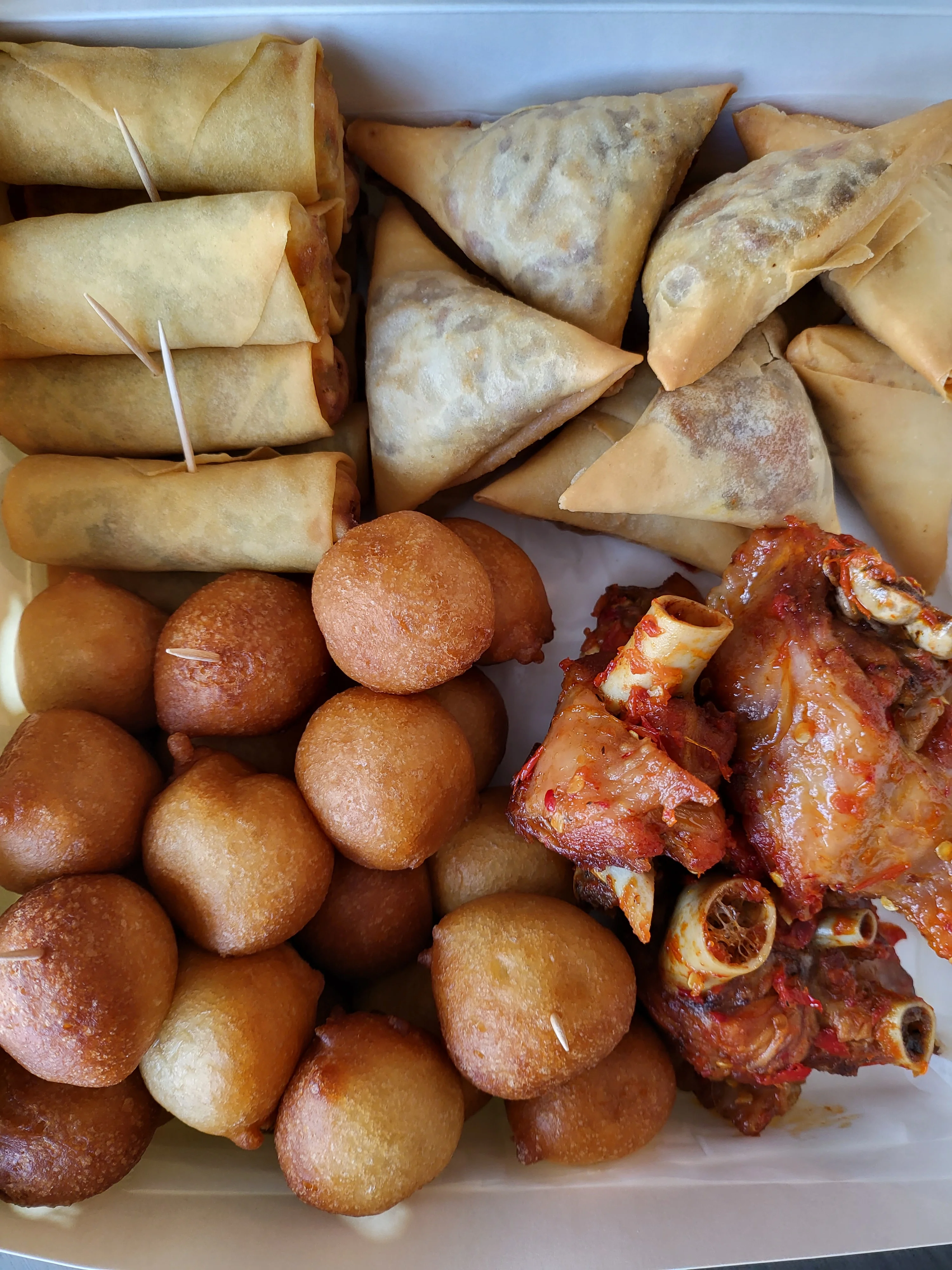 Assorted Indian snacks including samosas and pakoras