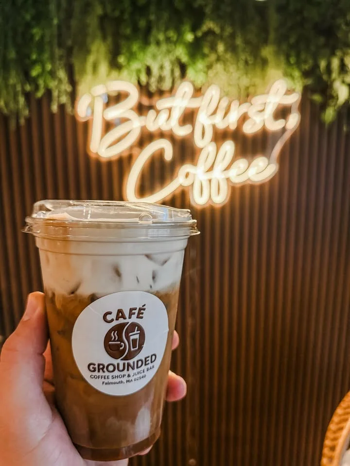 Iced coffee drink from Grounded Café with a cozy ambiance