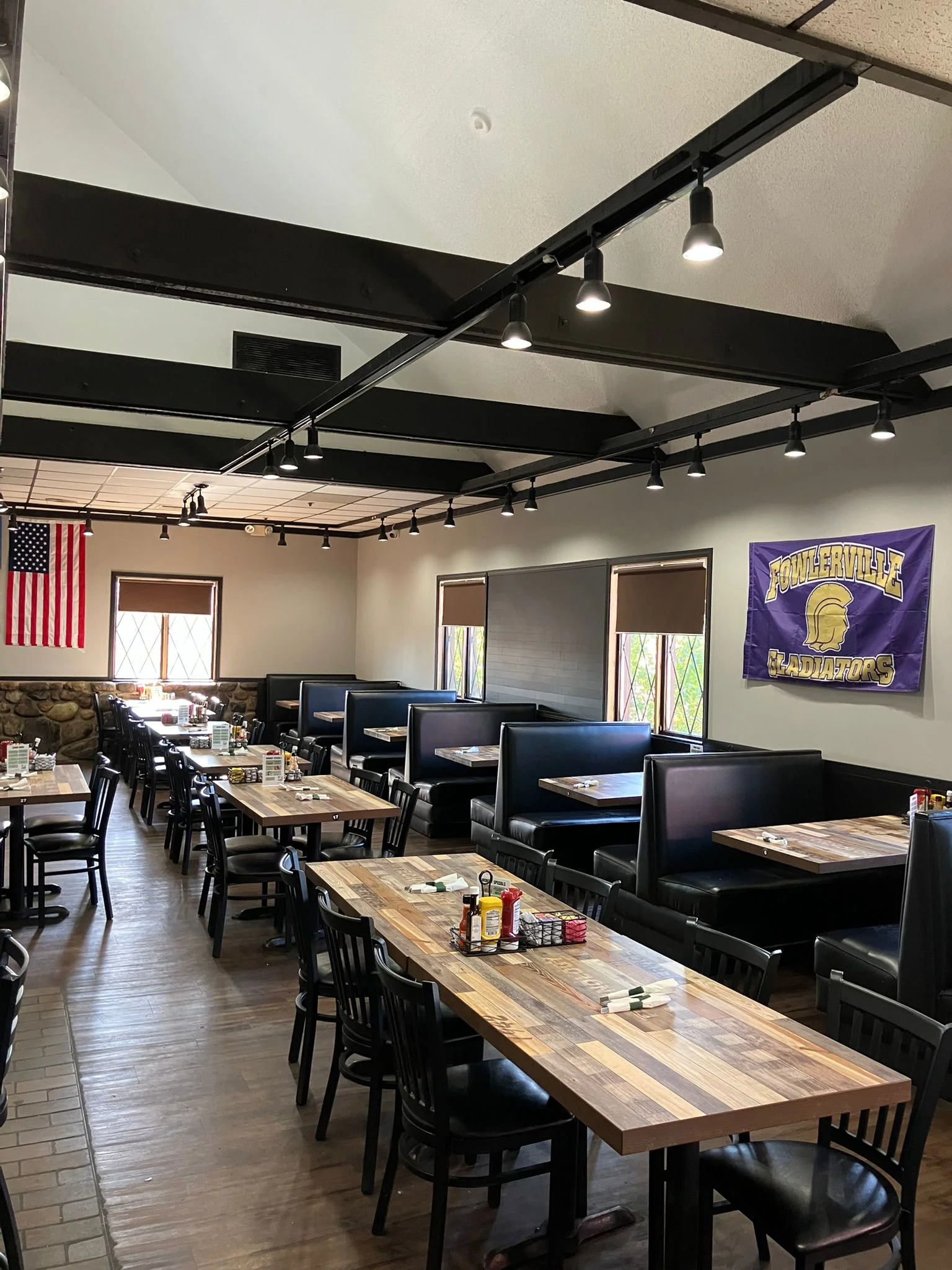 Cozy restaurant interior with booths and wooden tables