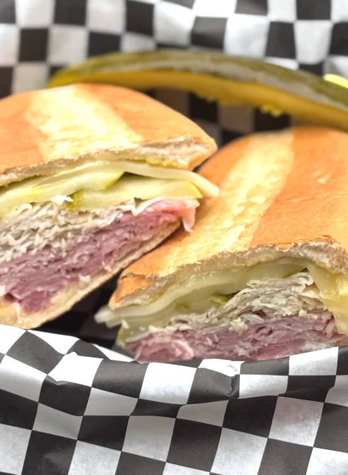 Classic deli sandwich with assorted meats and a side of creamy pasta salad