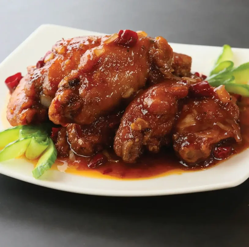 Sweet and spicy Chinese chicken wings on a plate