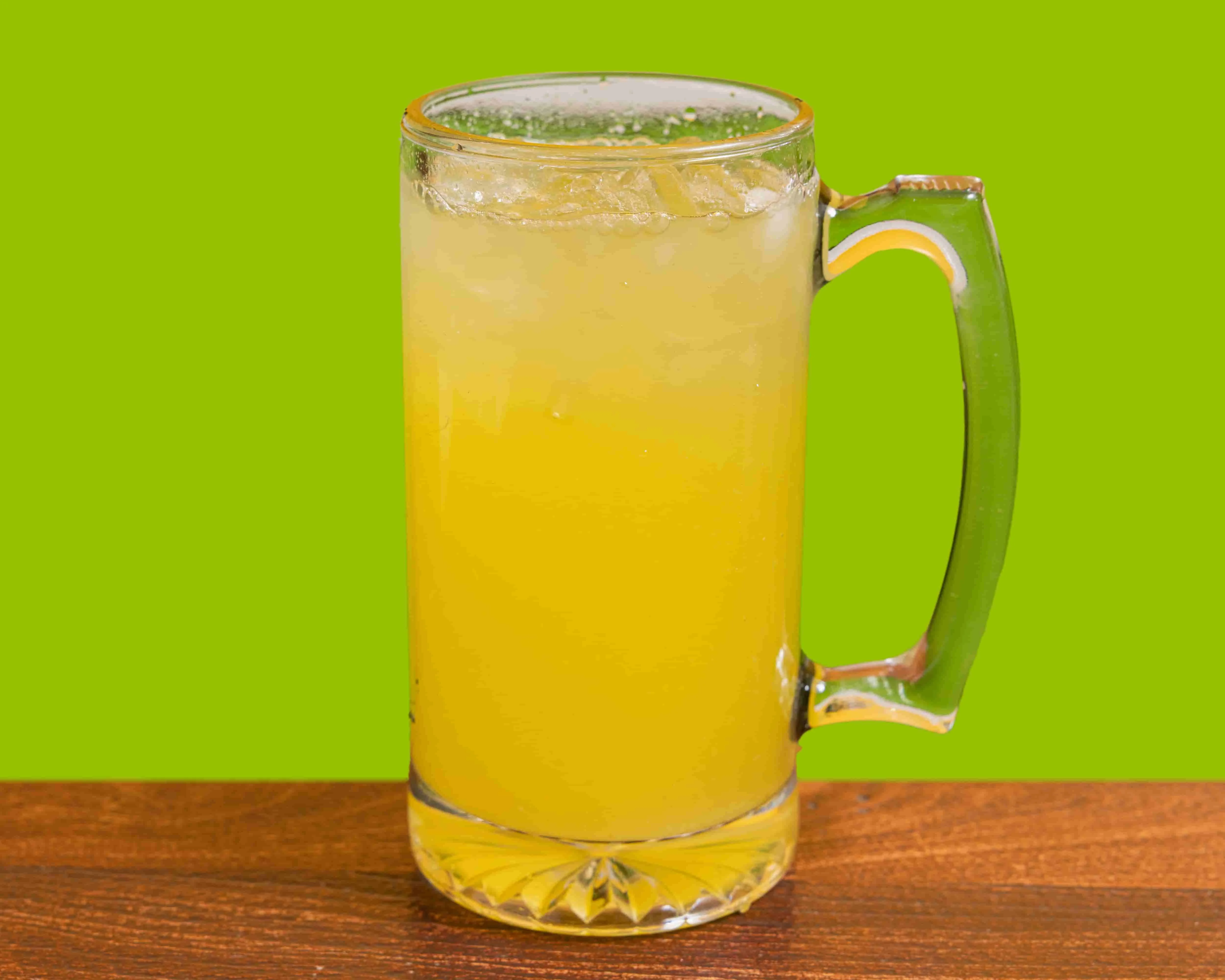 Refreshing tropical beverage in a glass mug