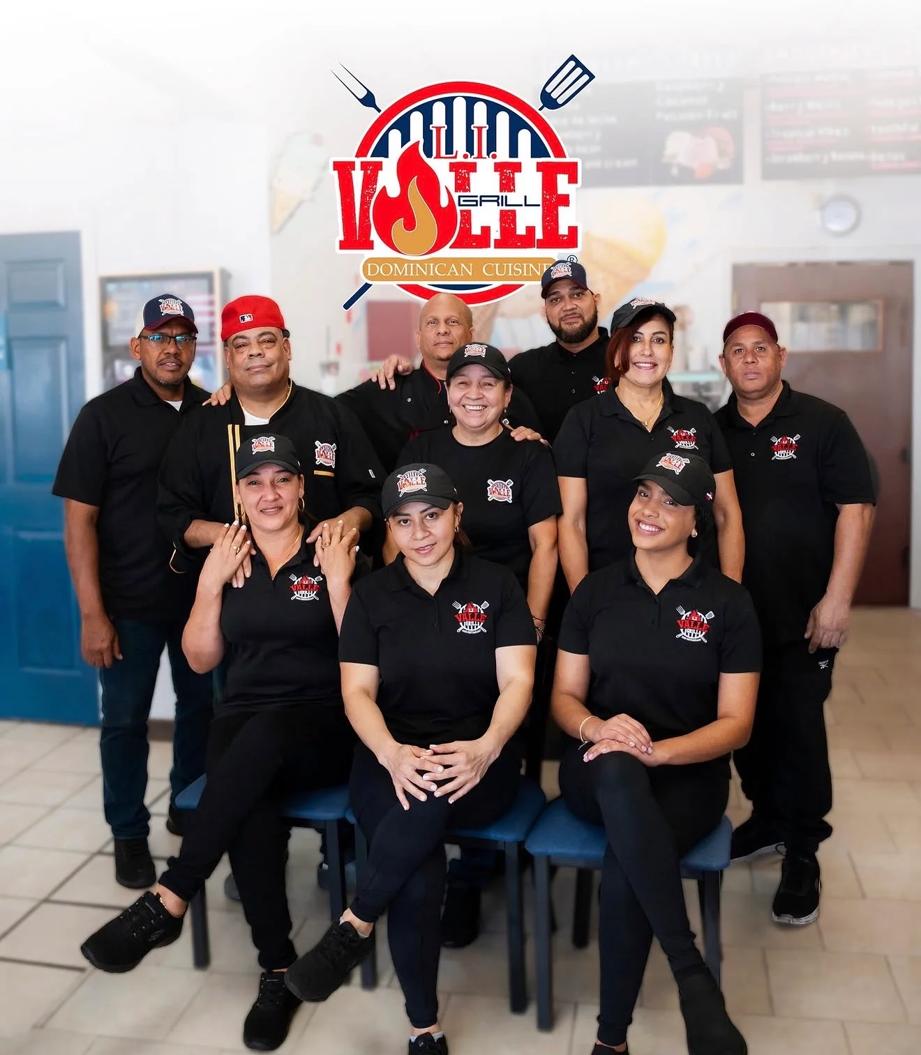 Team of staff at a Dominican restaurant with logo in background