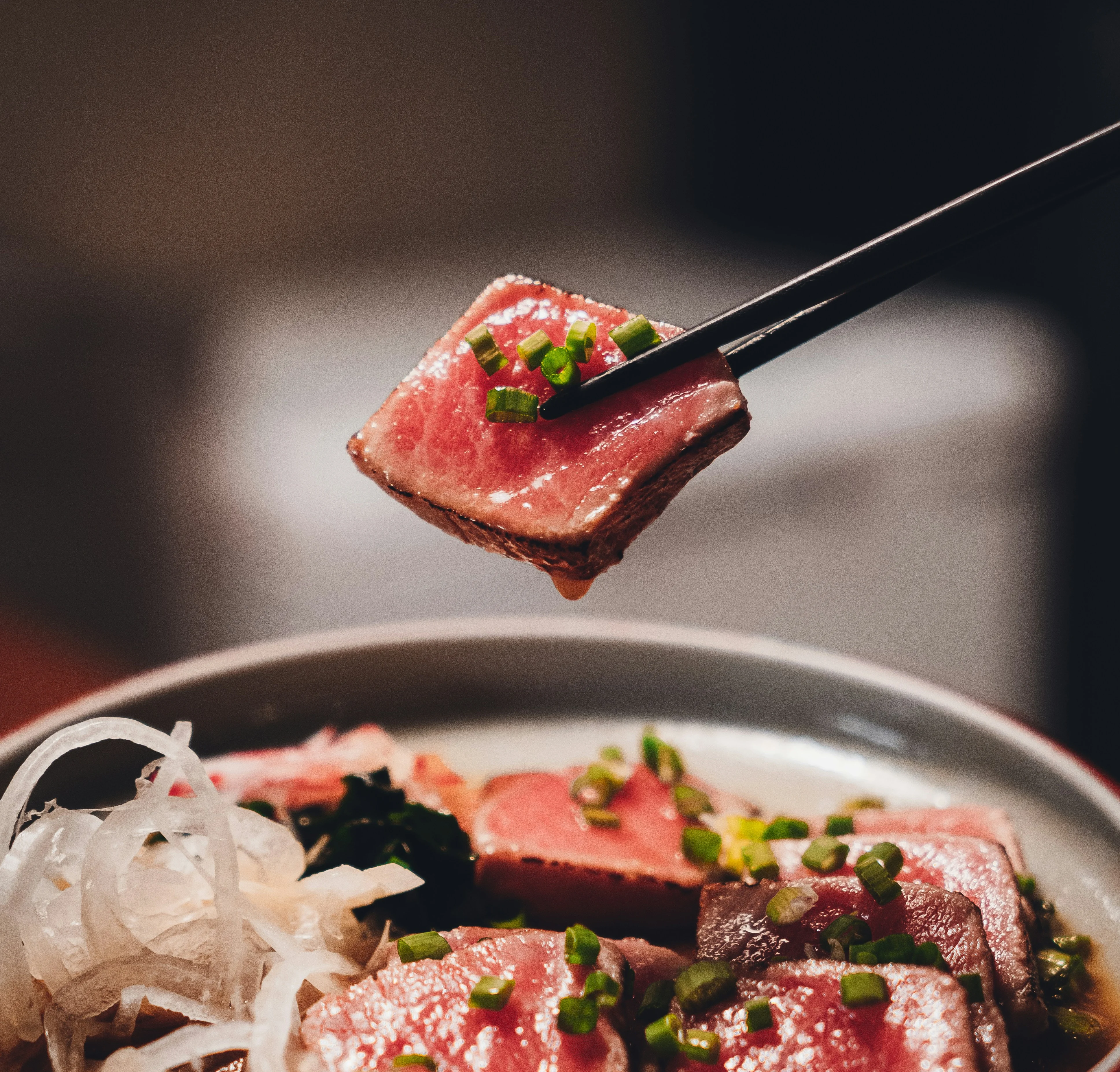 Sliced Japanese wagyu beef with green onions