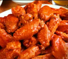 Crispy buffalo chicken wings served with celery sticks