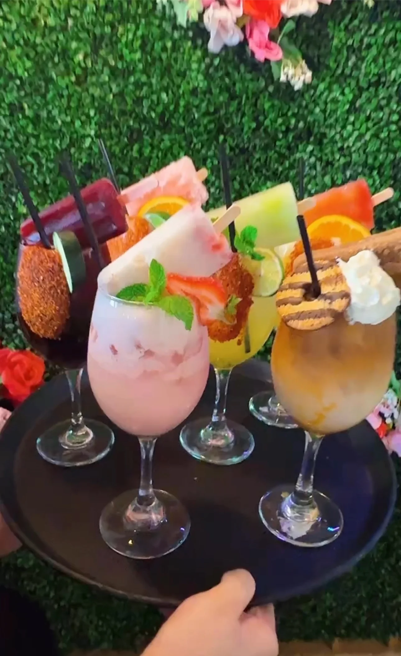 Colorful assortment of refreshing cocktails with popsicles