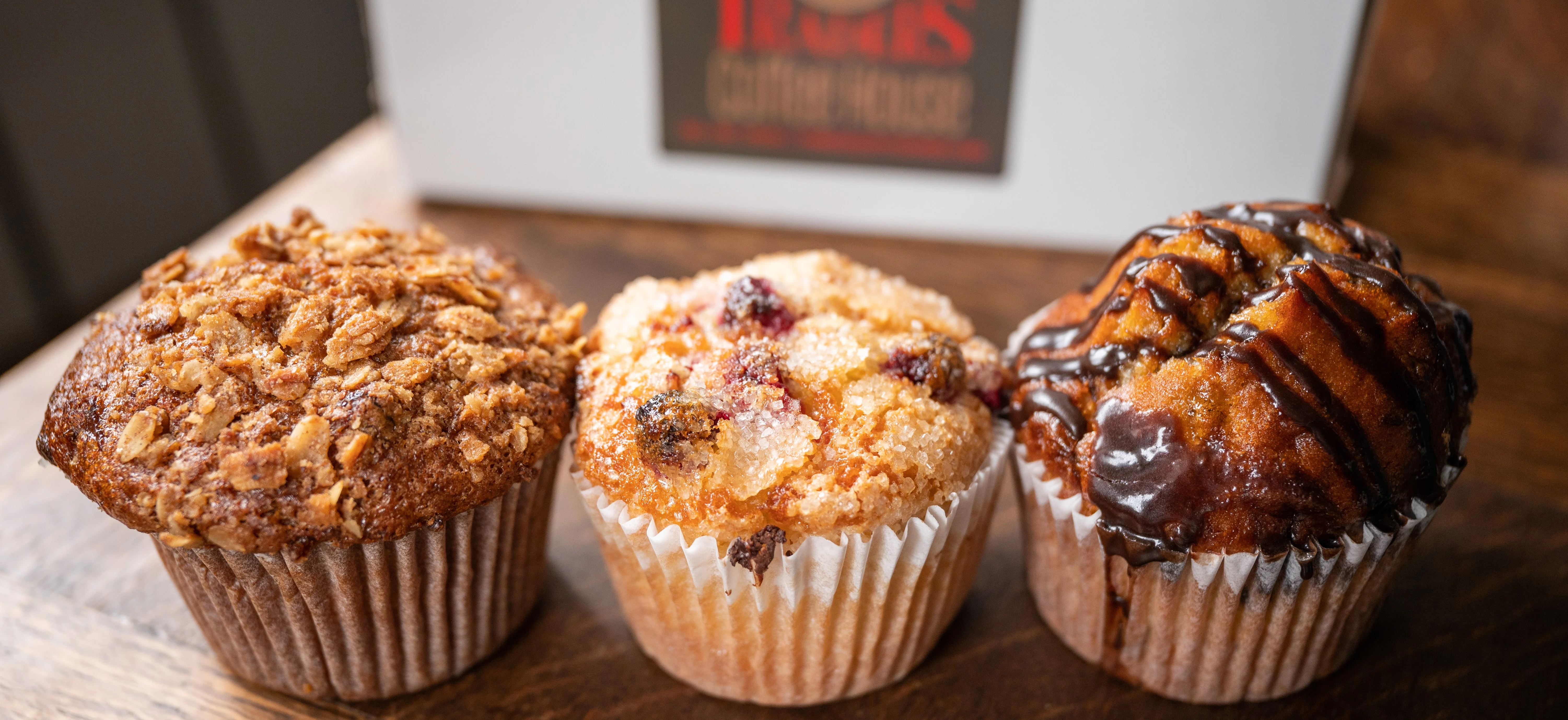 Assorted gourmet muffins in a bakery setting