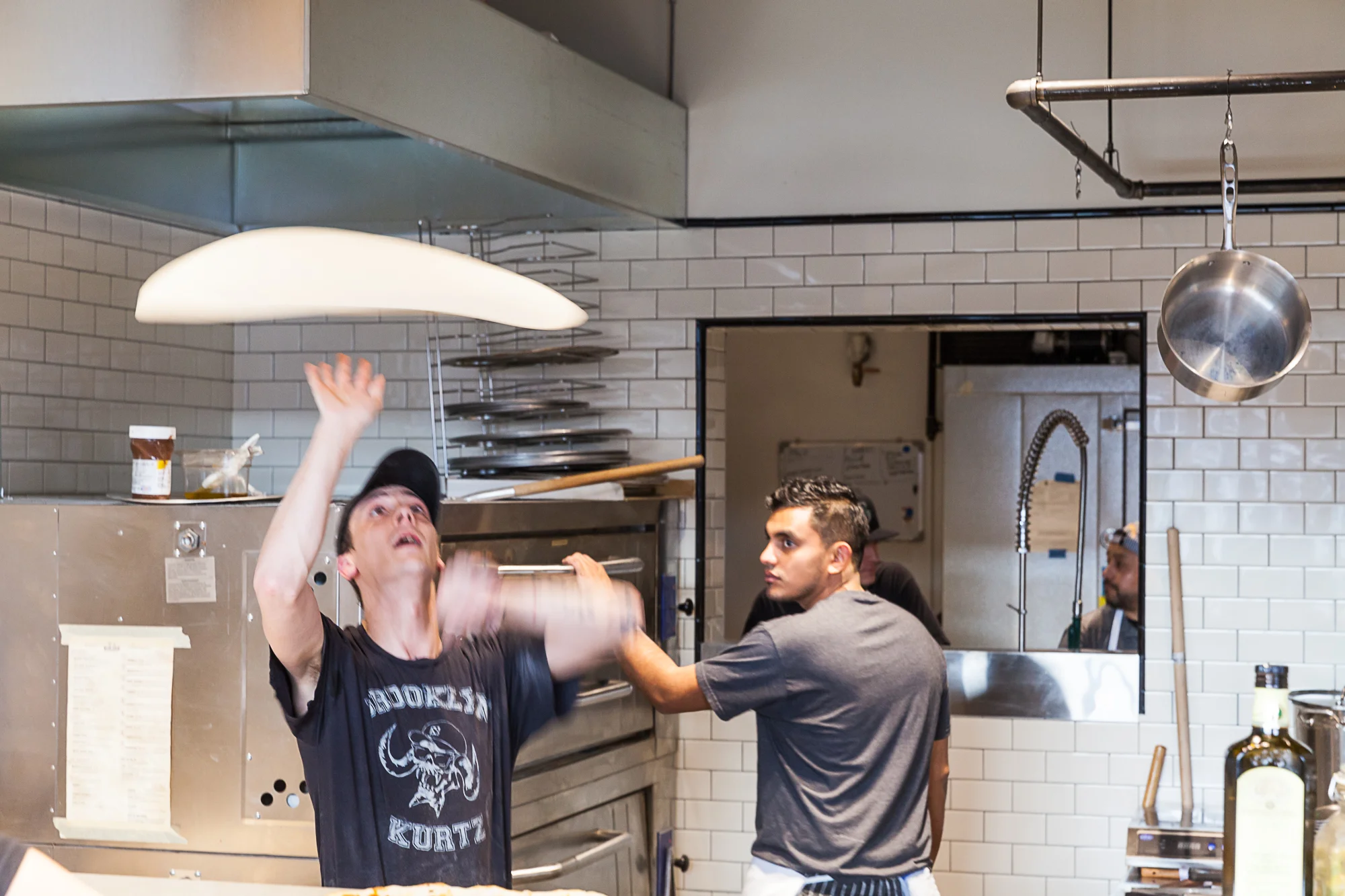 tossing pizza