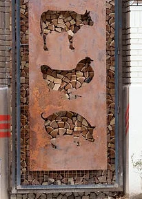 Artistic metal sculpture of farm animals