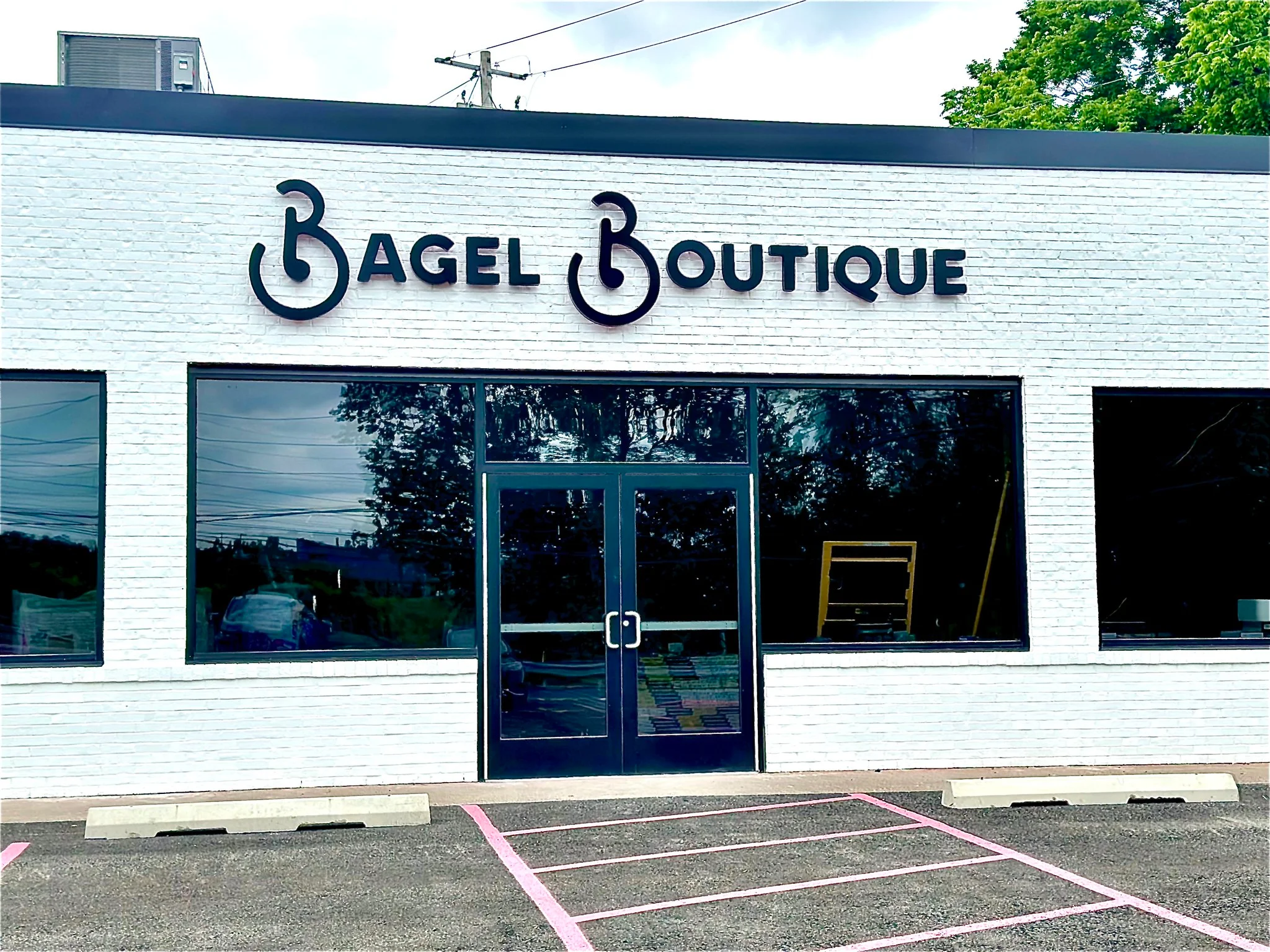 Exterior view of Bagel Boutique restaurant with modern signage