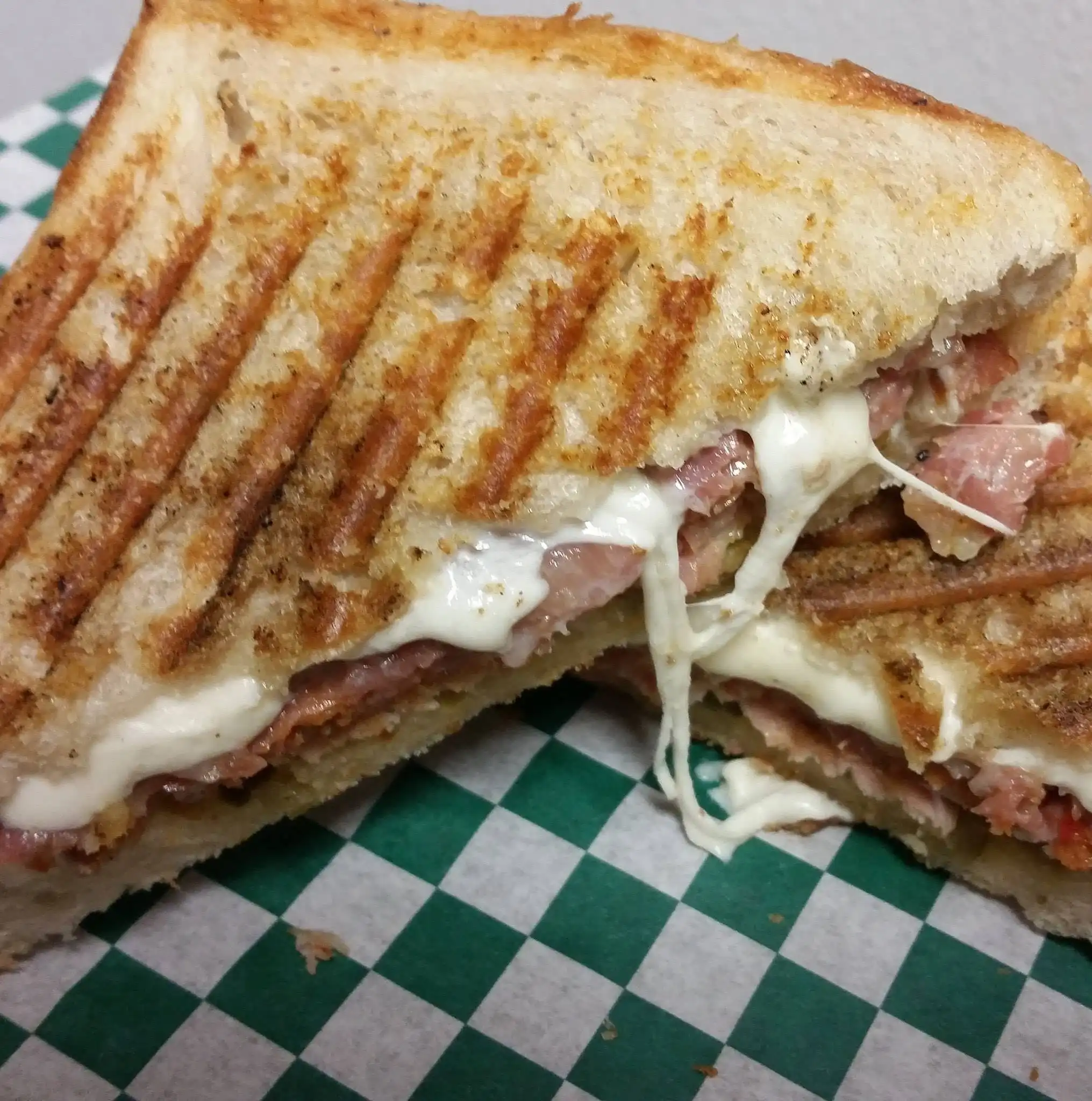The Campo has whole roasted chicken shredded and tossed w/olive oil, romaine, & fresh basil w/sliced mozzarella & tomato on our soft ciabatta.