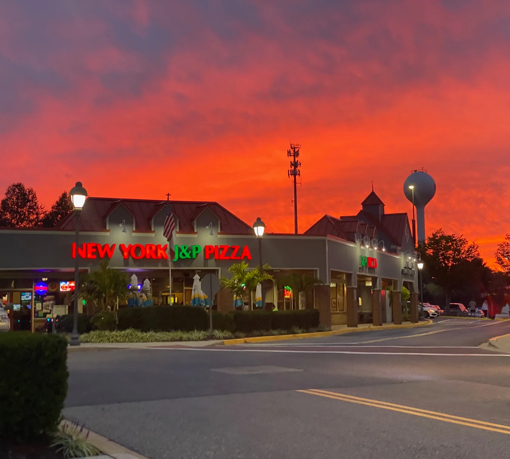 New York-style pizza restaurant at sunset