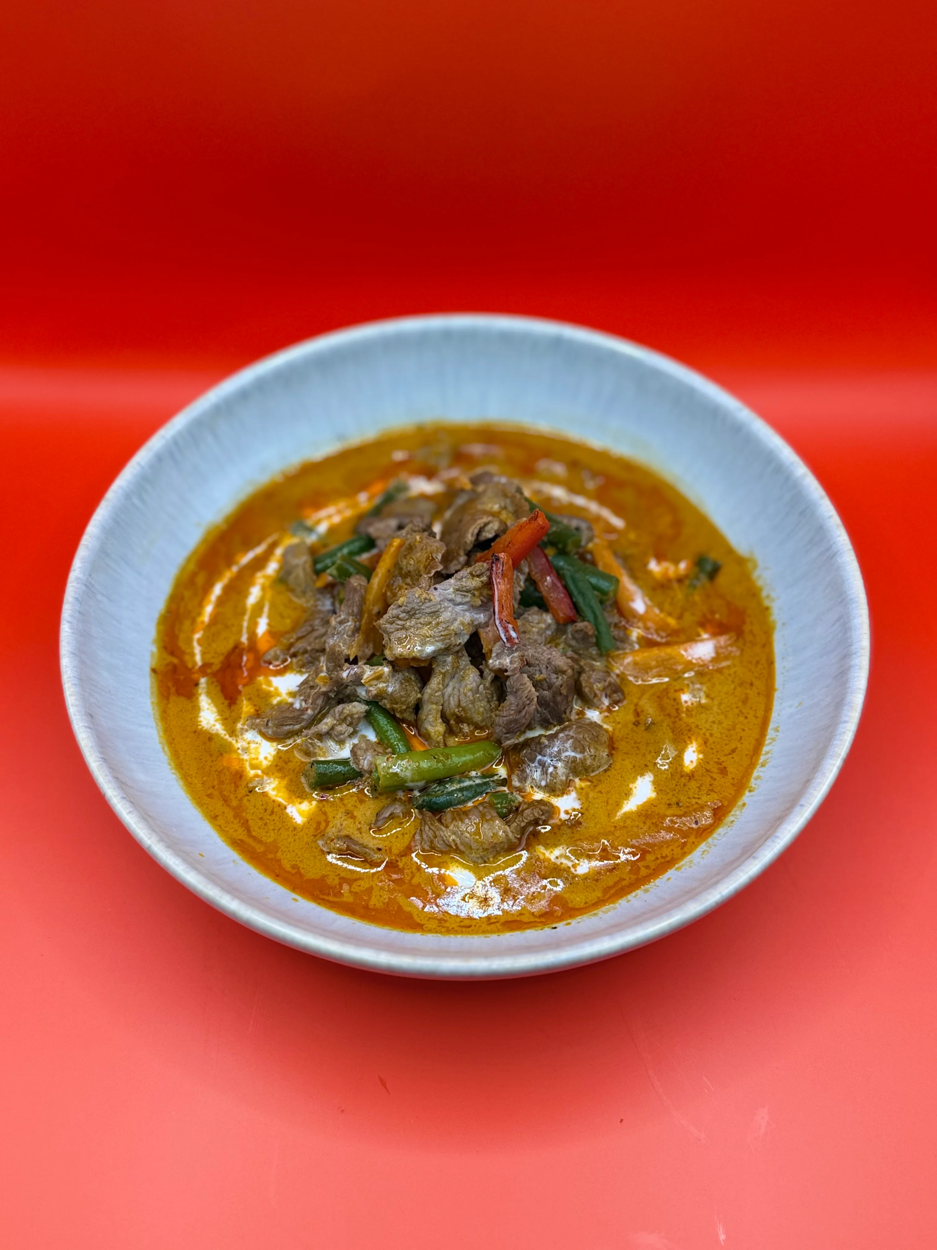 Rich Malaysian beef rendang in a bowl