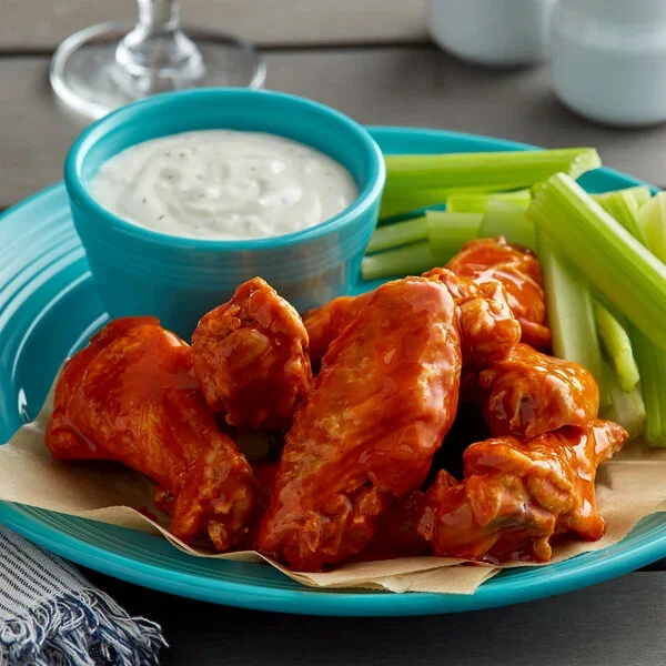 Buffalo chicken wings with ranch dip and celery sticks