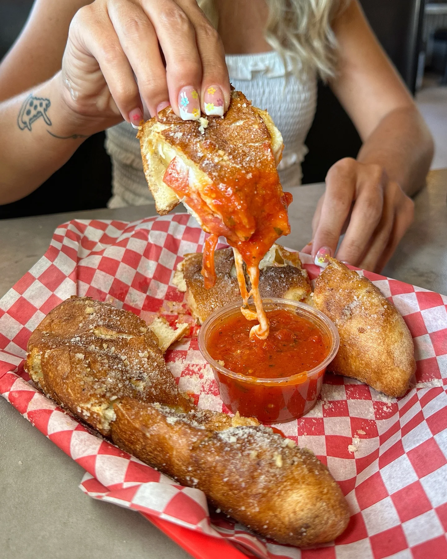 Stadium Pepz pizza rolls stuffed with mozzarella and pepperoni, dipped in marinara