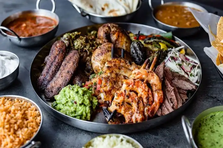 ImageCan’t decide? This one has it all! A selection of all the meats we offer plus the veggies. Includes our hand-made tortillas, fresh guacamole, and more!