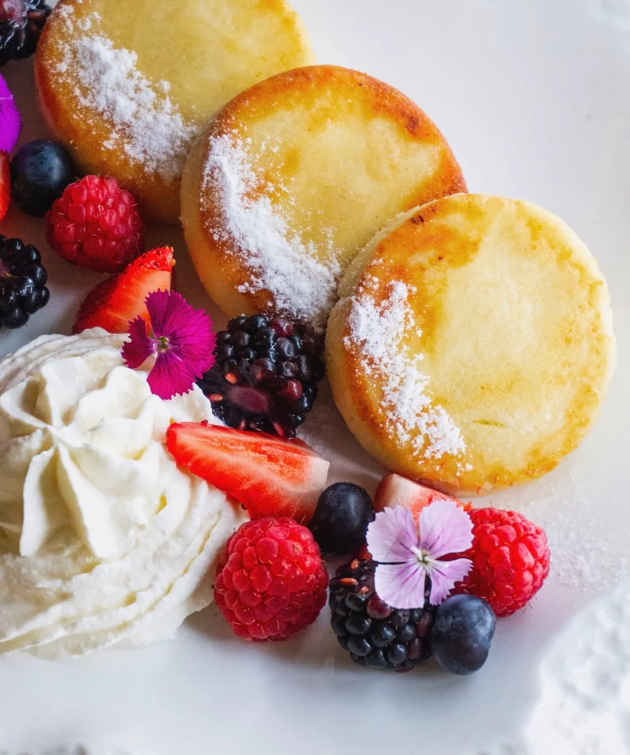 Fluffy Japanese pancakes with berries and whipped cream