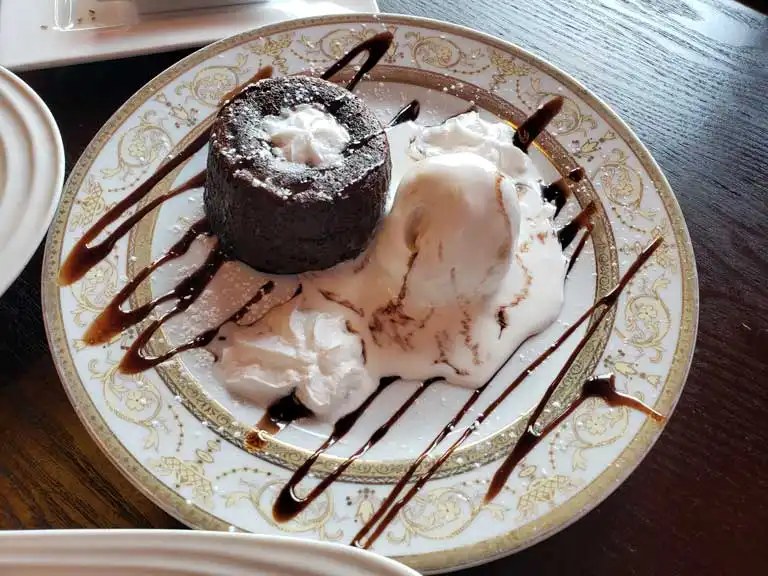 Chocolate lava cake with ice cream and whipped cream