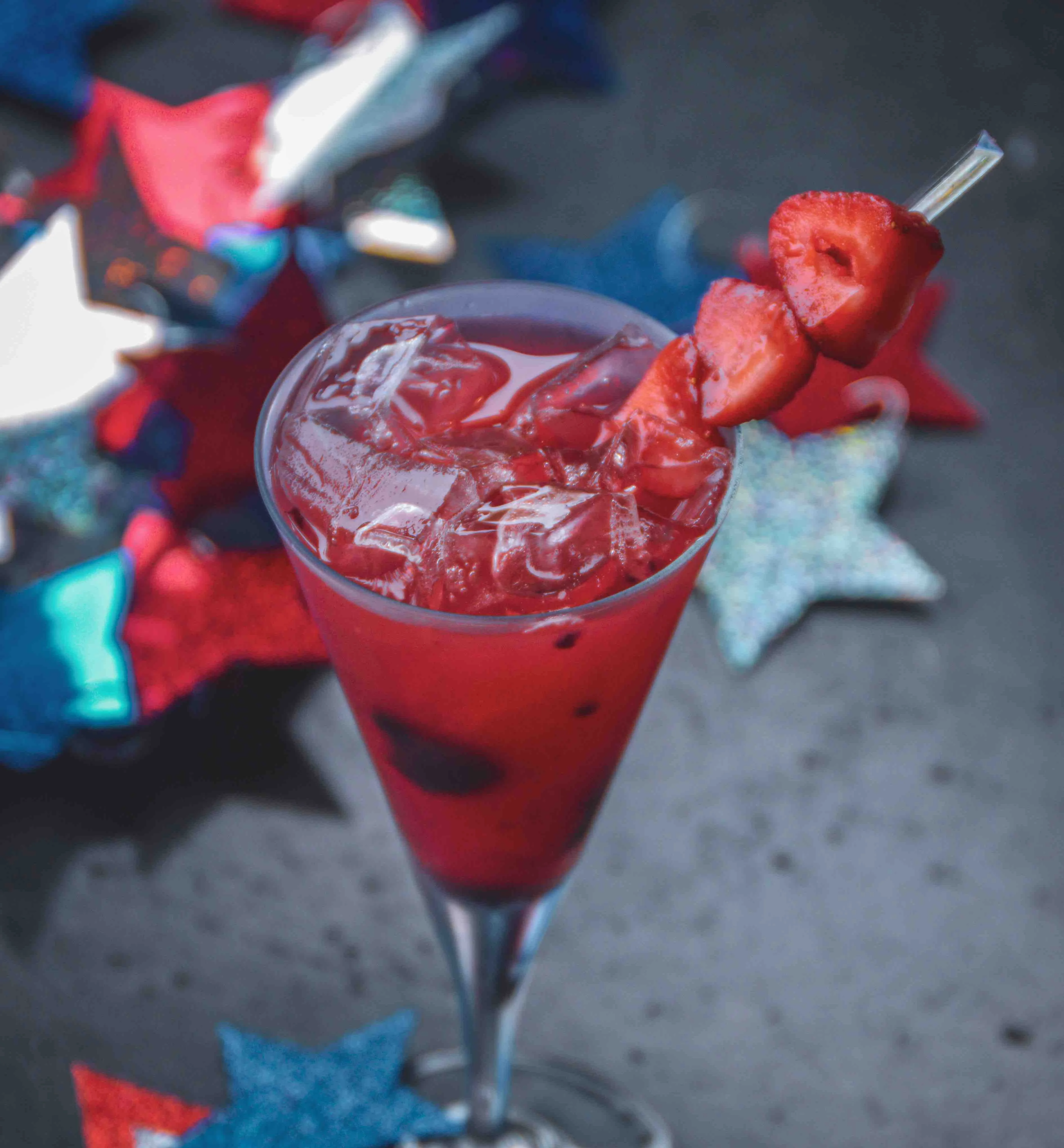 Triple Berry Blast cocktail outside with red, white, and blue stars in the background