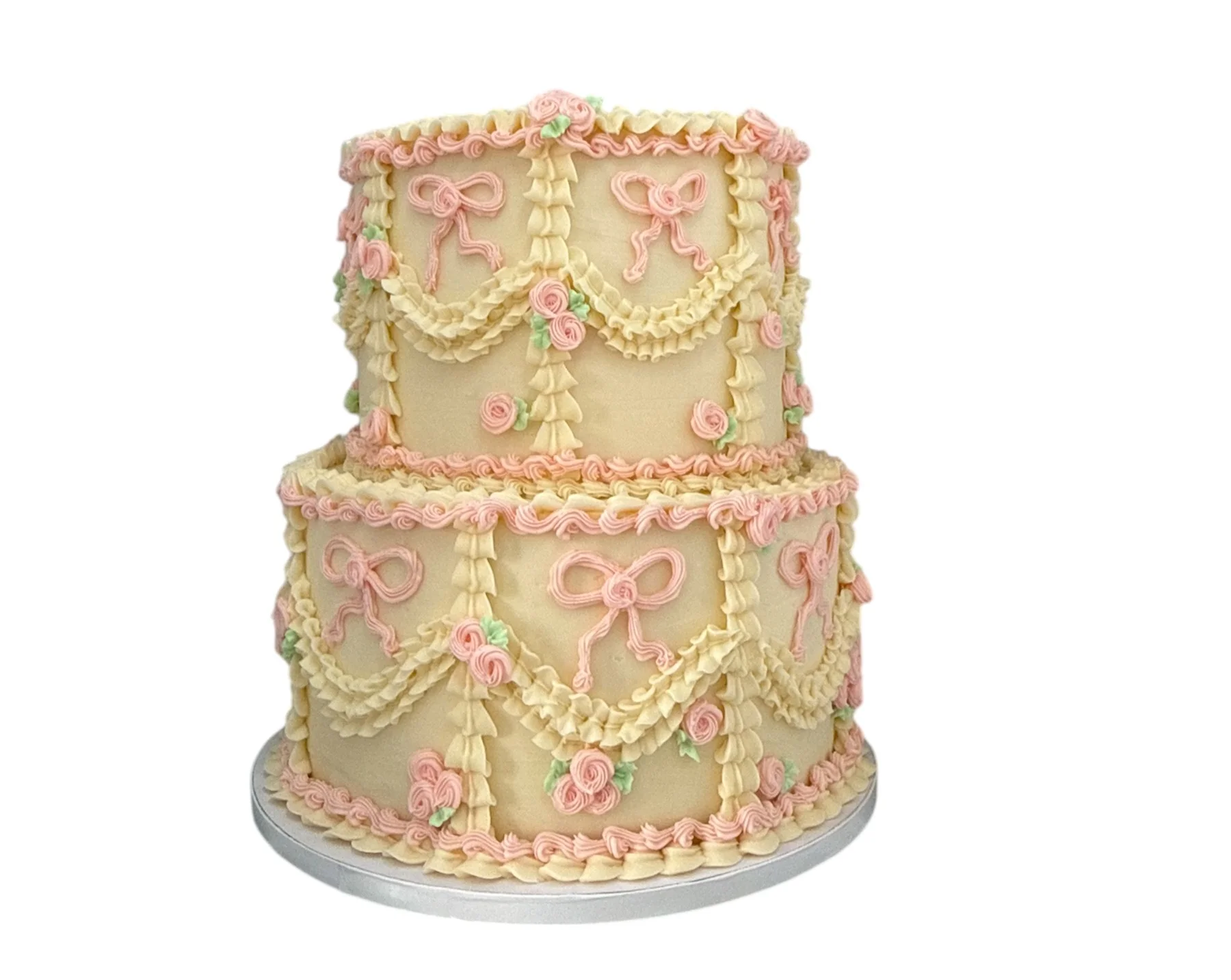 Elegant two-tier wedding cake with pink floral decorations