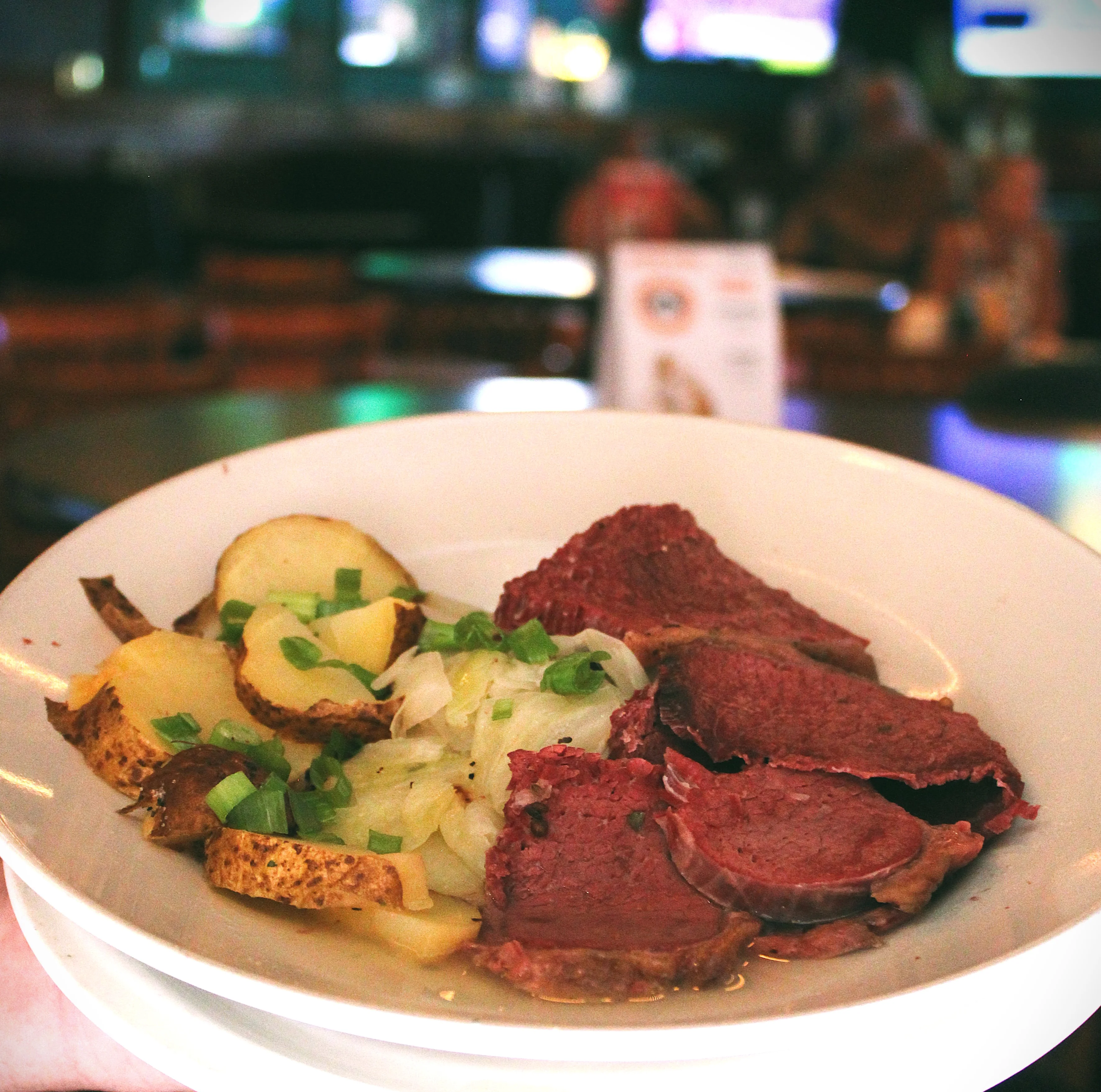 Traditional corned beef and cabbage served with potatoes