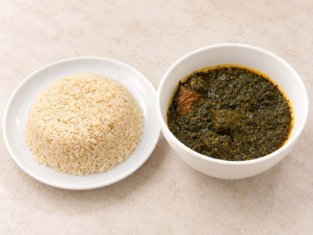 A serving of rice accompanied by a green leafy sauce, likely containing meat, displayed in two separate bowls.