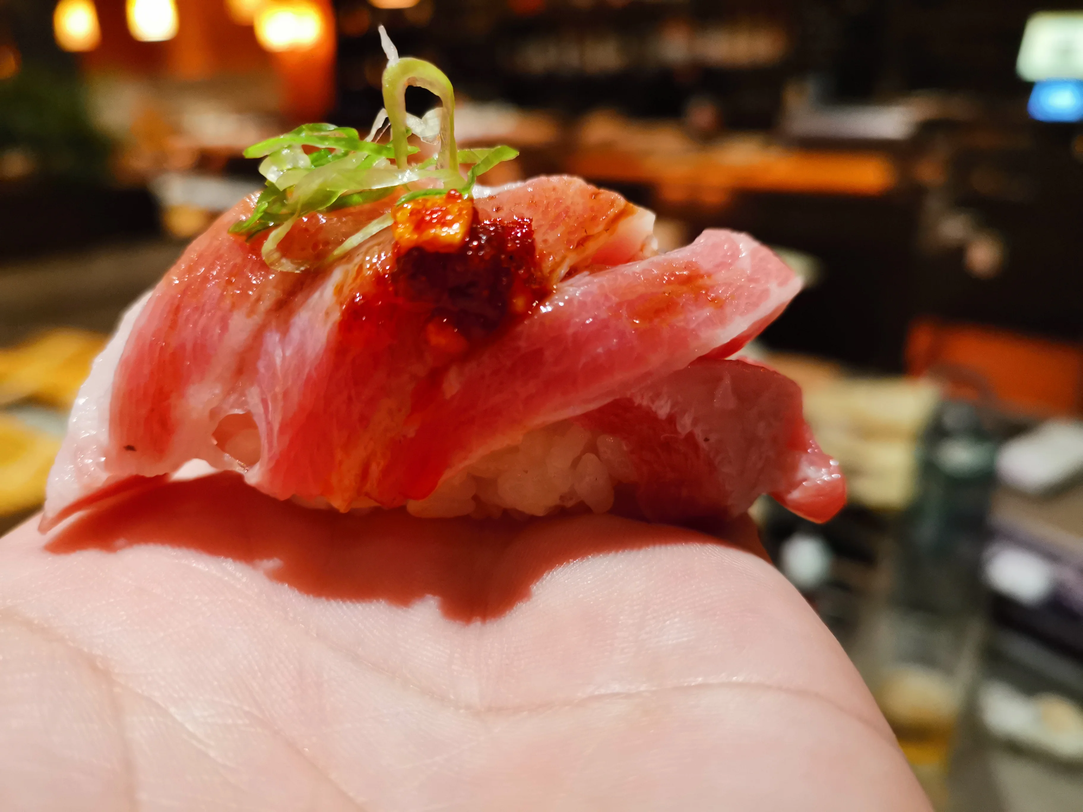 Japanese sushi roll with bonito flakes and eel sauce