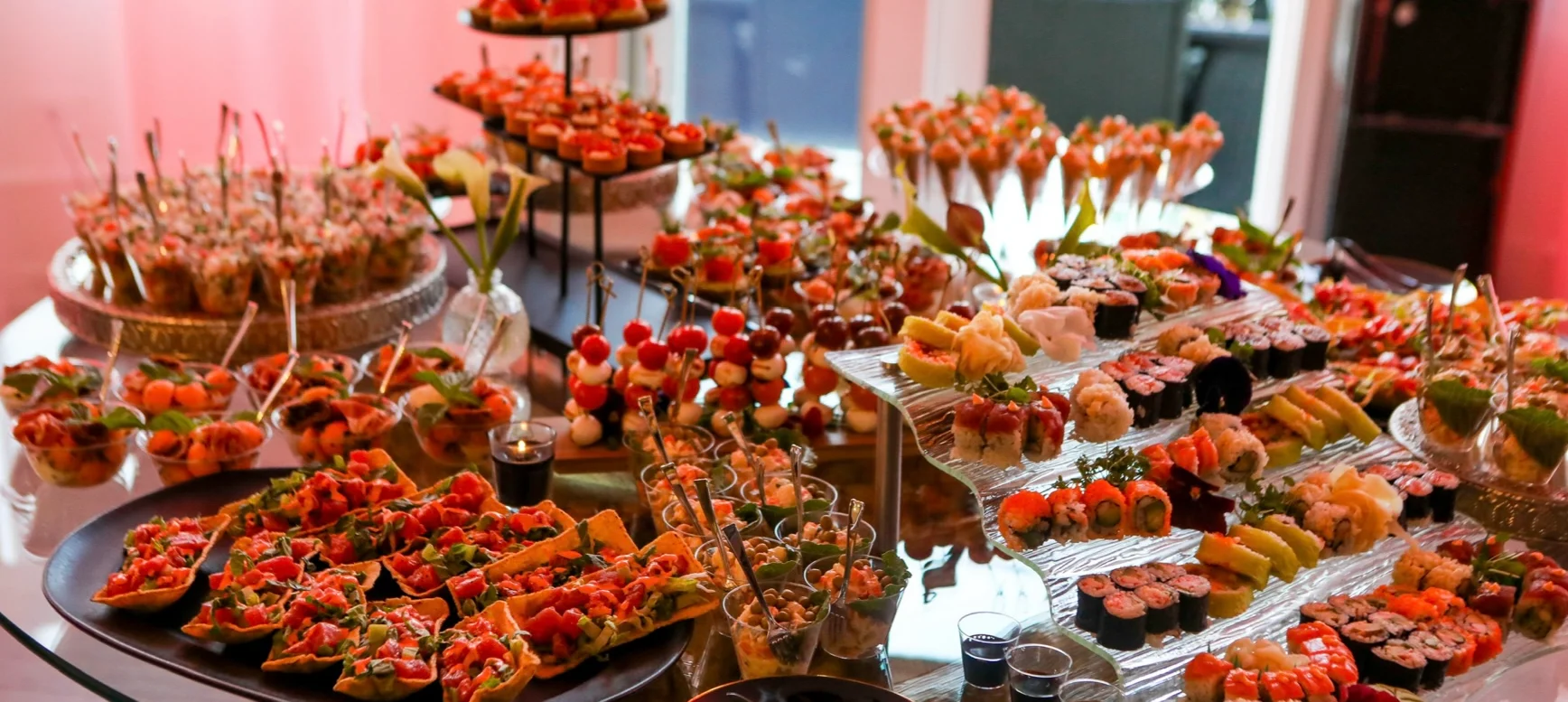 Assorted sushi and appetizers at a lavish buffet table