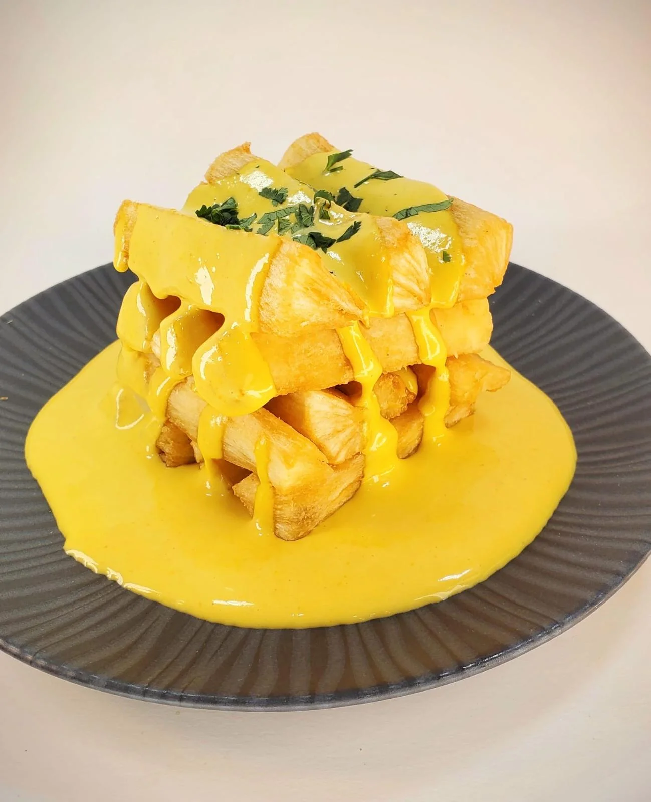 Colorful Peruvian causa with avocado and seafood