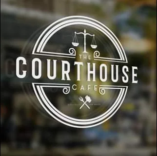 Logo of The Courthouse Cafe featuring scales of justice