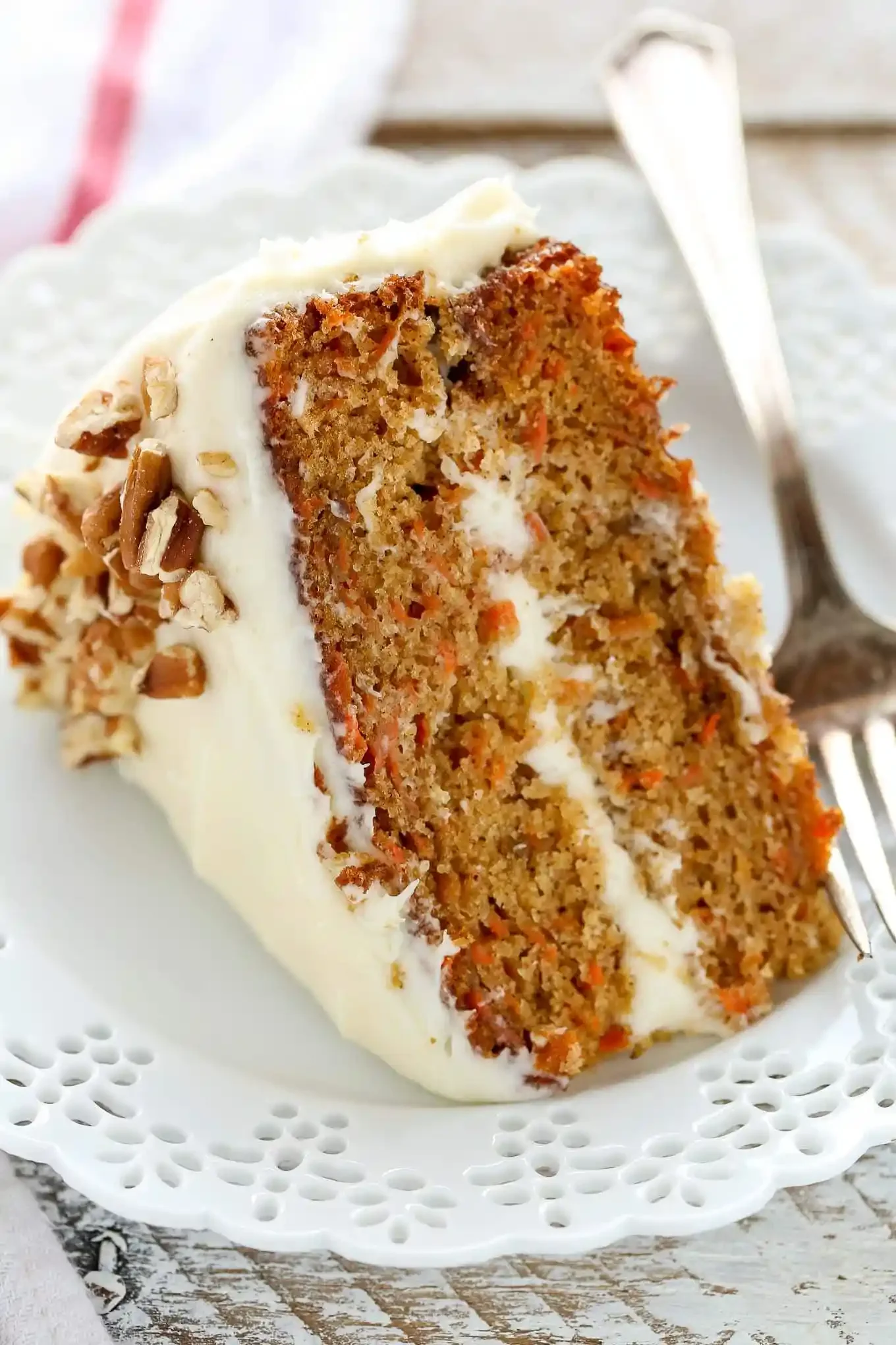 Slice of classic carrot cake with cream cheese frosting
