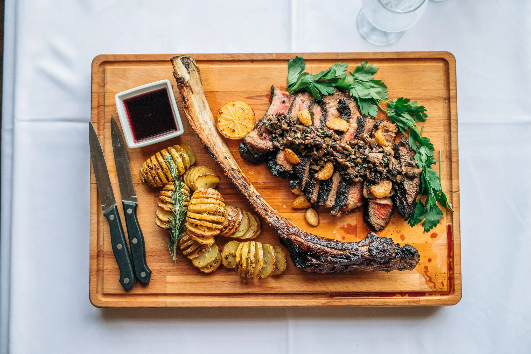 Juicy tomahawk steak with garlic and herbs