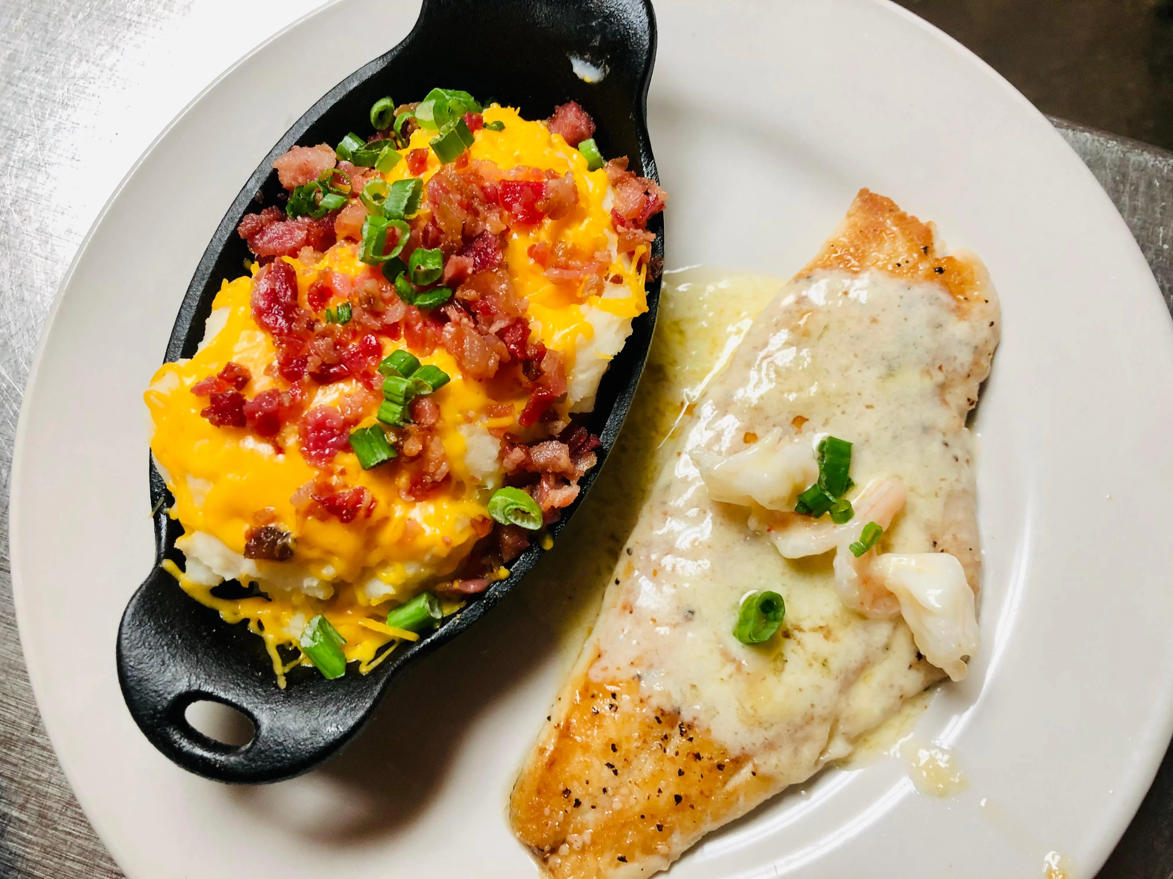 Southern-style baked fish with loaded mashed potatoes