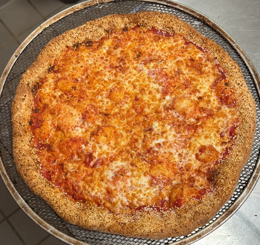 Classic cheese pizza served on a metal tray