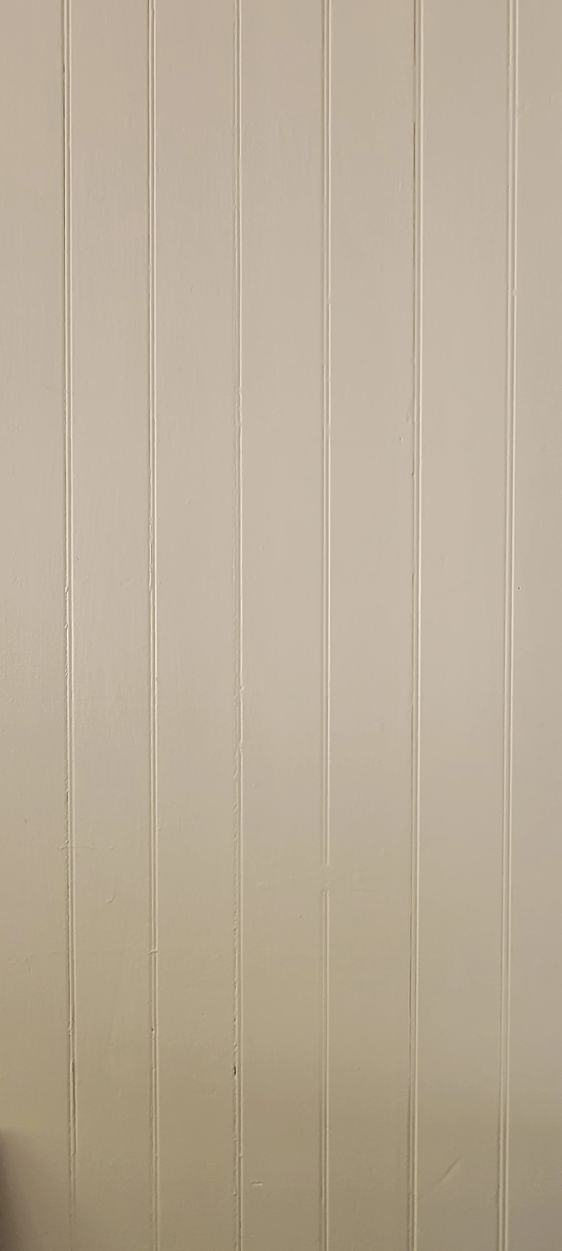Textured wooden wall with vertical panels