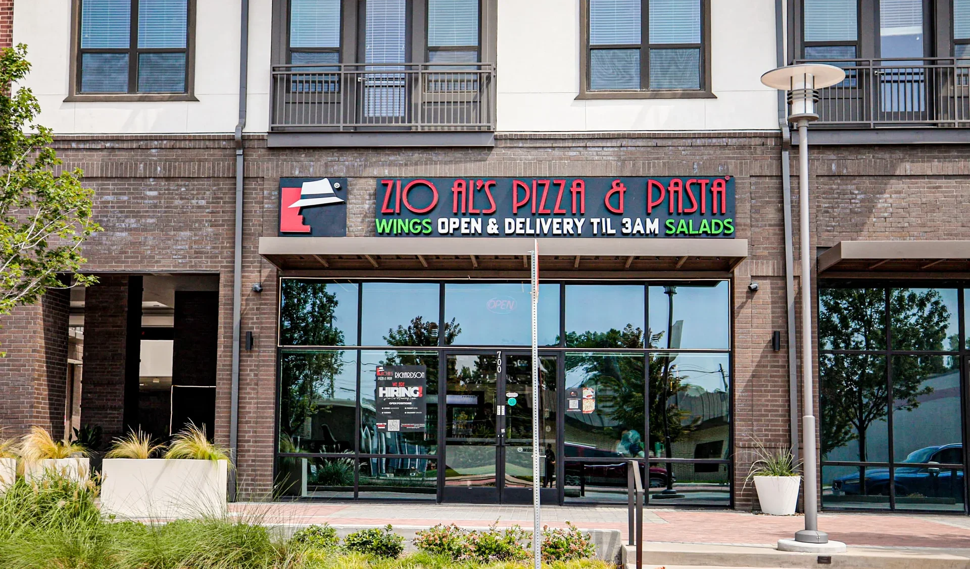 Exterior of Zio Al's Pizza & Pasta restaurant with open sign