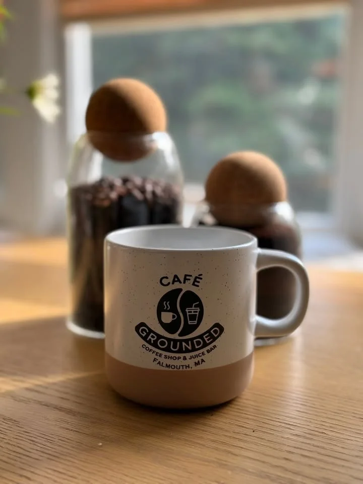 Café Grounded coffee mug on a wooden table