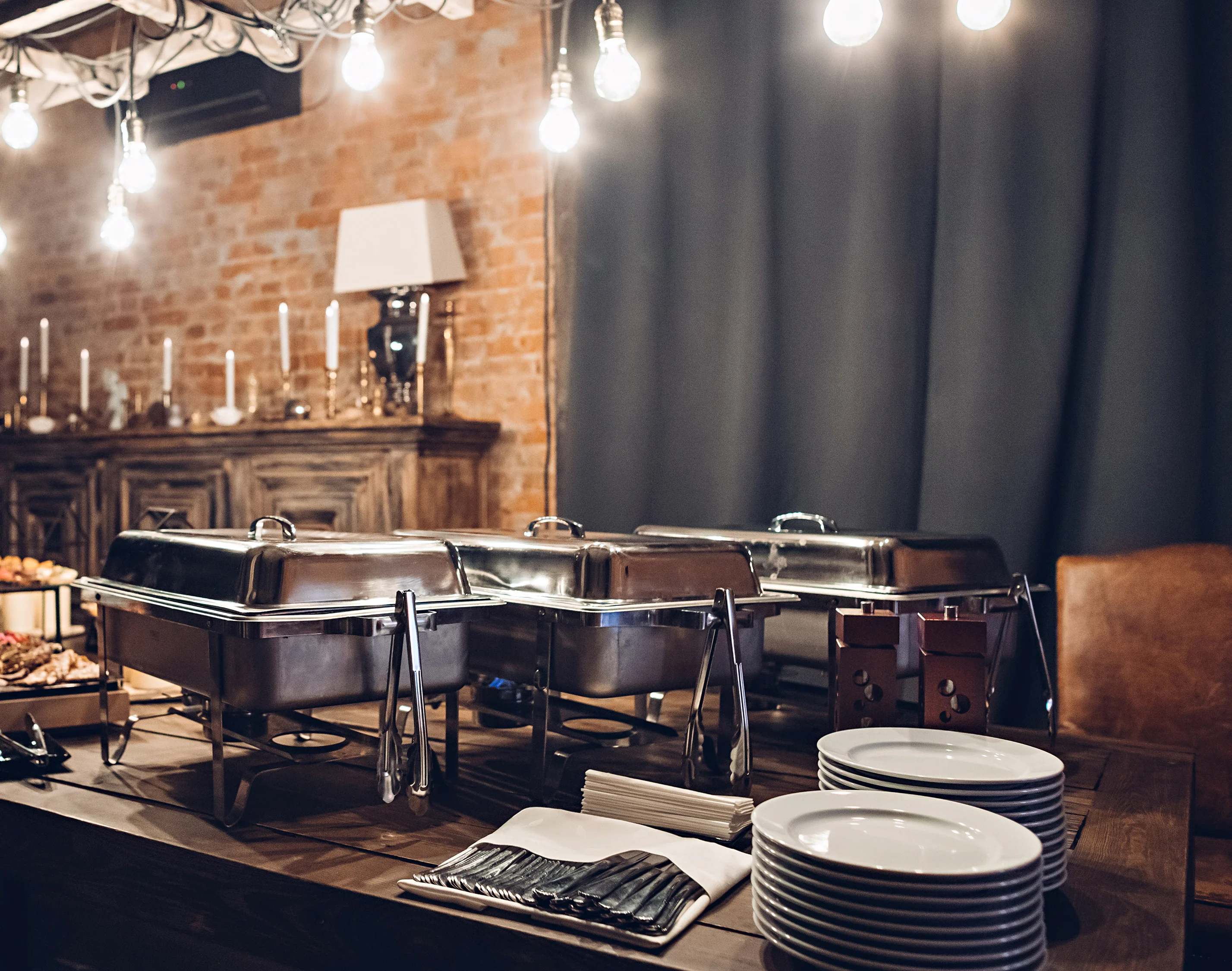 Elegant buffet setup with warm lighting and rustic decor