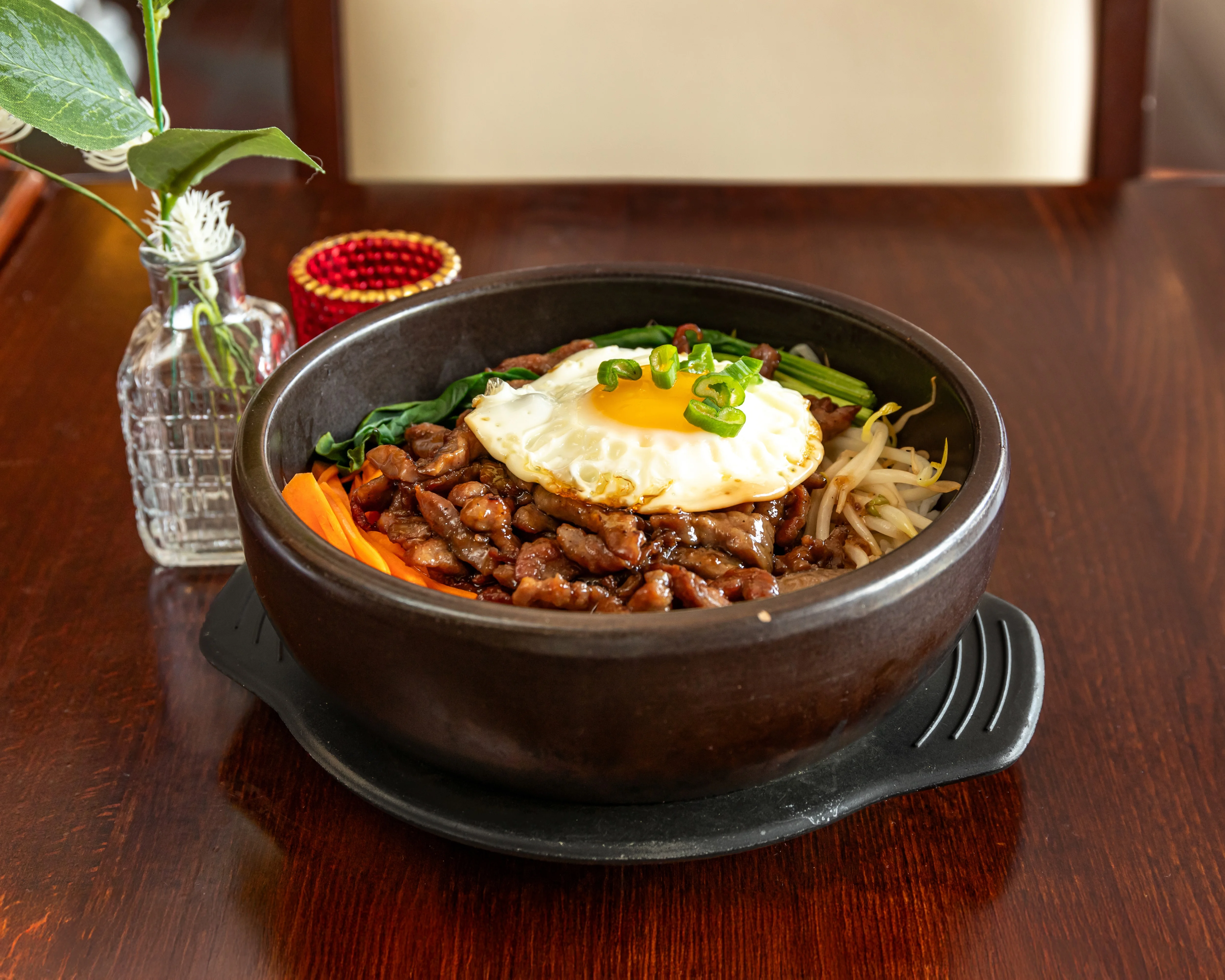 Korean bibimbap served in a hot stone bowl